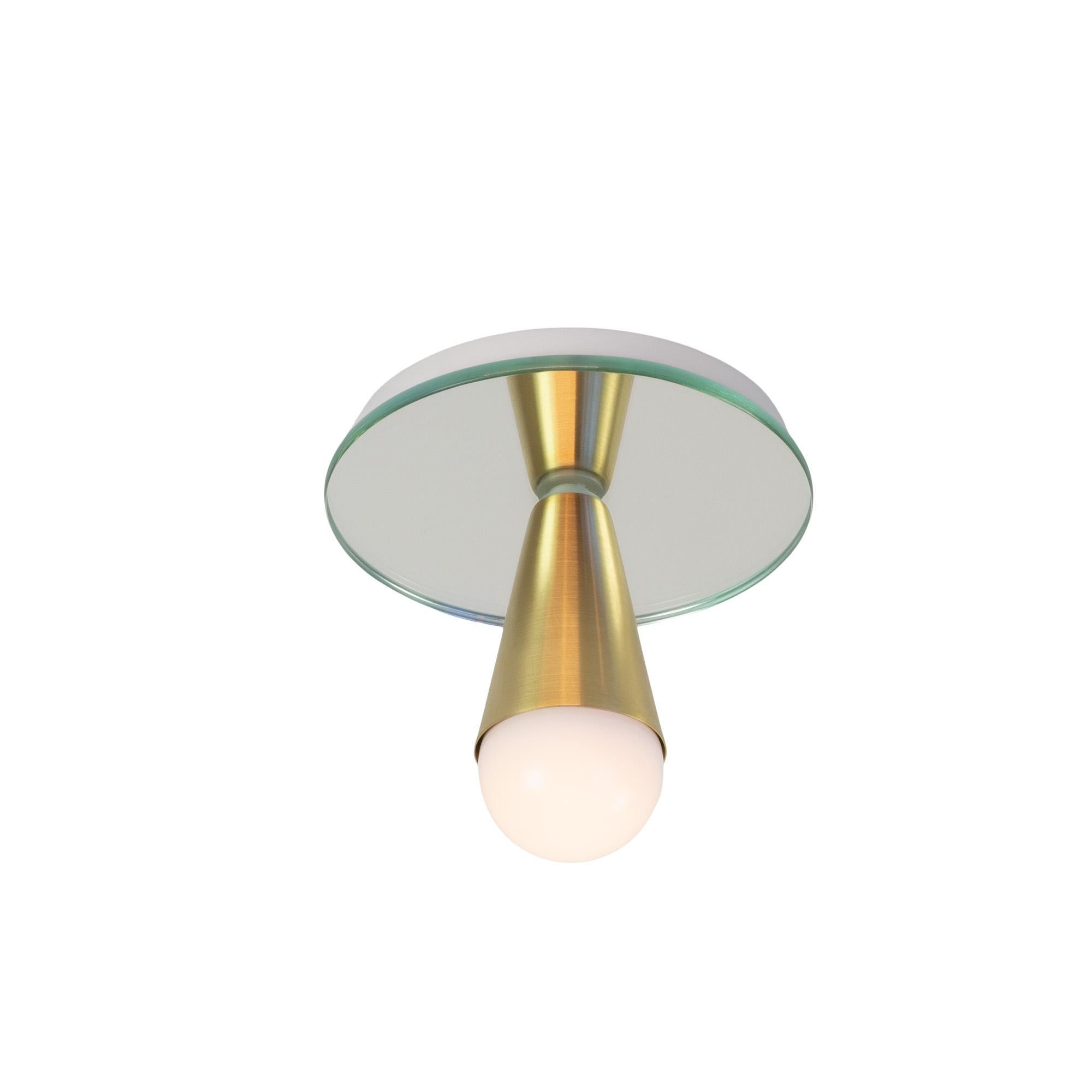 This listing is for a pair of the Echo One Flush Mounts. They also work well as sconces.

Simple, elegant and playful, the Echo Series is a line of surface-mount fixtures that can be used on a wall or ceiling. White or brass cones mount to