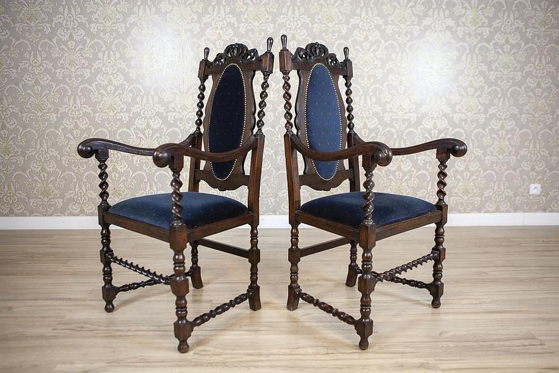 Pair of Eclectic Carved Oak Armchairs from the Late 19th Century

We present you two oak armchairs with softly upholstered seats and backrests.
The whole is dated Q4 of the 19th century.
The turned legs are connected with stretchers which are turned