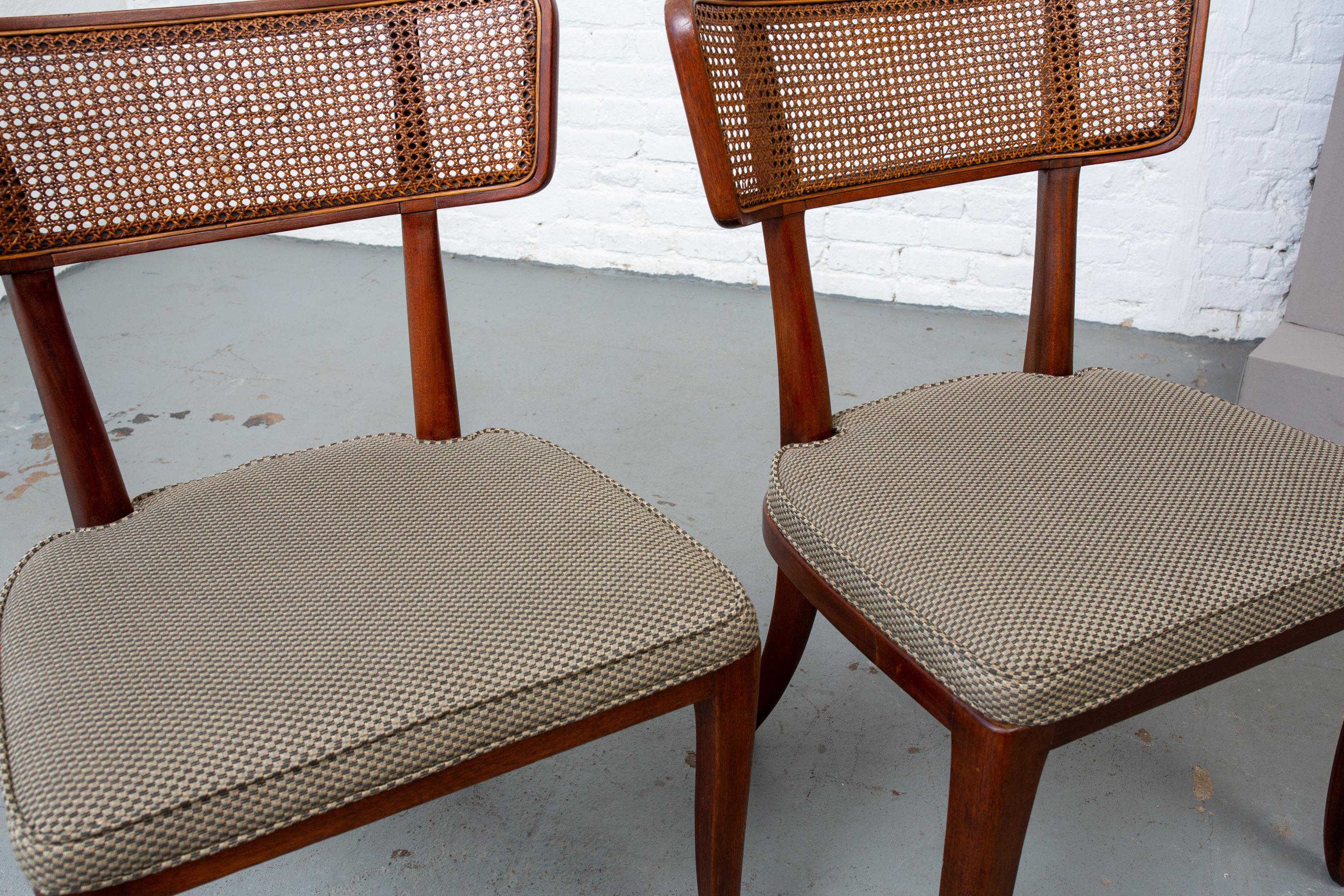 Pair of Mid-Century Modern cane back side chairs with splayed legs in espresso brown. Original upholstery with cane in good condition. Wide back and seat make for a very comfortable chair.