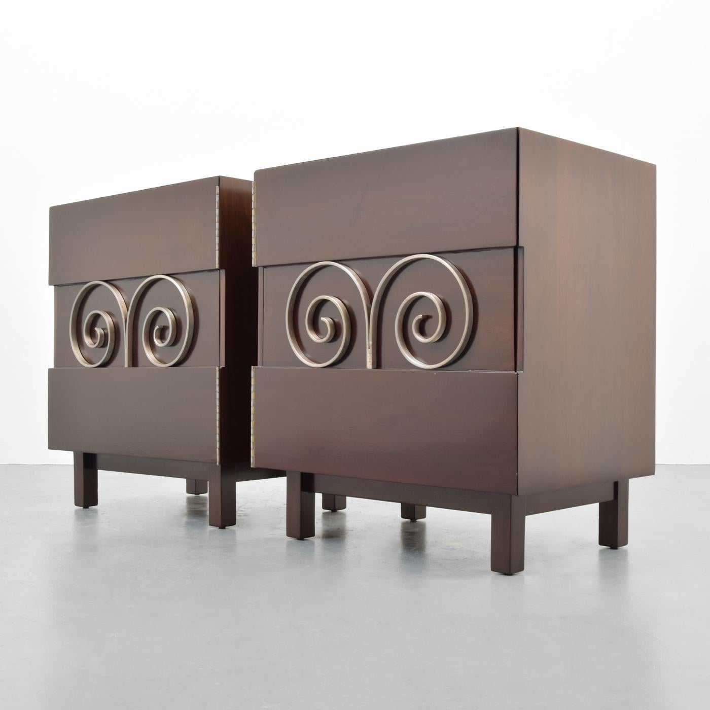 Pair of cabinets or nightstands by Edmond Spence. 

Materials: Mexican mahogany, nickelled brass

Markings: Branded marks.
    