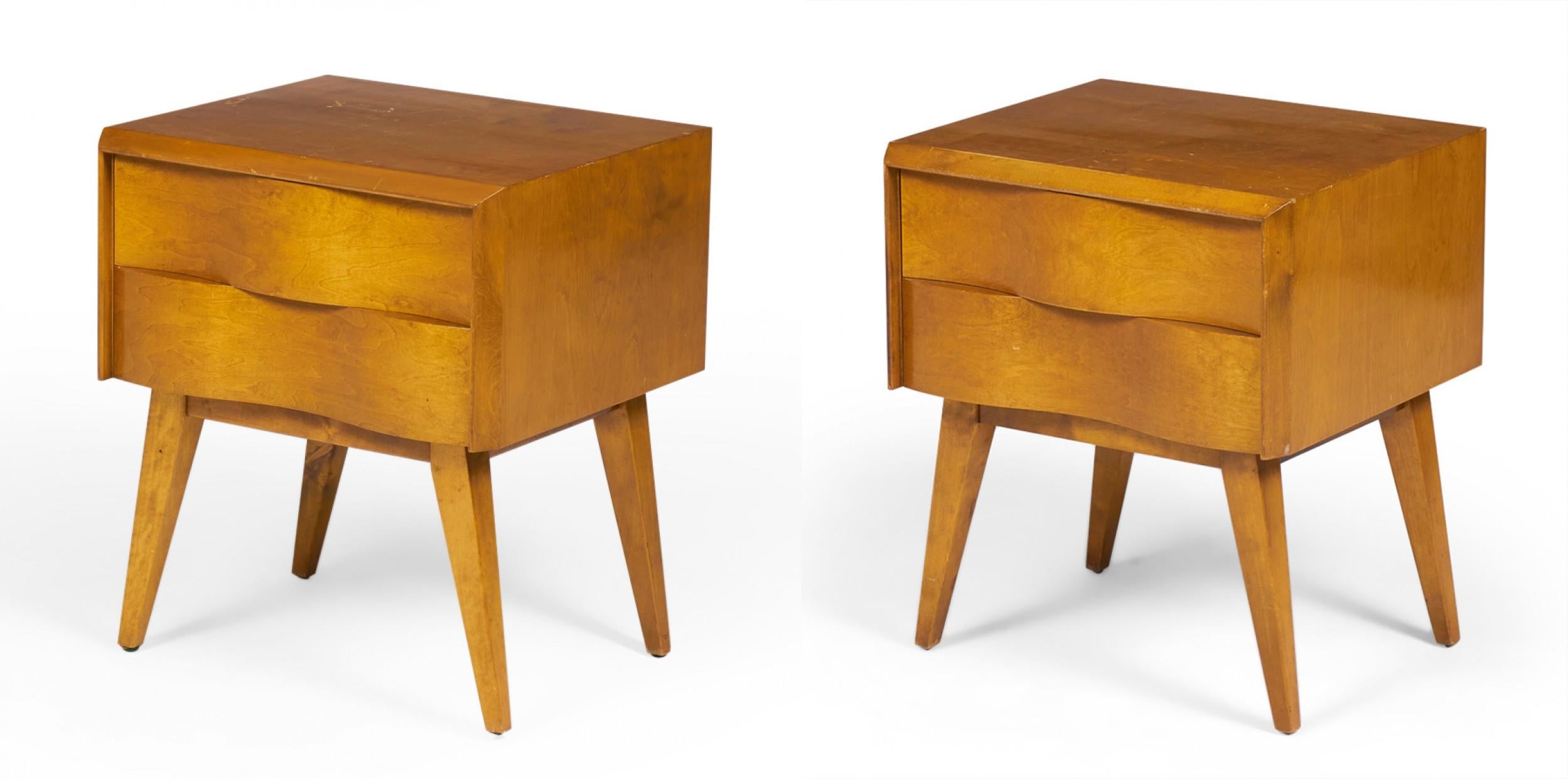PAIR of Swedish Mid-Century (1940s) wave front birchwood nightstands with two drawers in a birchwood case resting on four tapered angled legs. (EDMOND SPENCE)(PRICED AS PAIR)(Matching chest of drawers: DUF0136)
