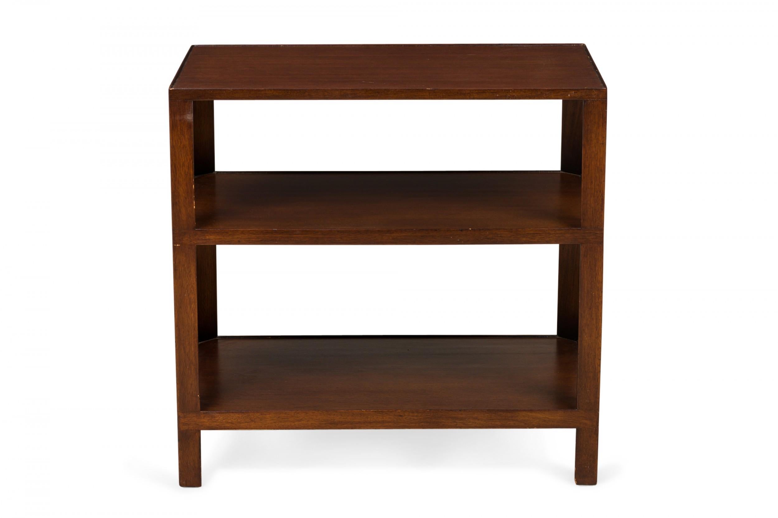 PAIR of American Mid-Century wooden end tables with a rectangular top and two identical lower shelves supported by four square legs. (EDWARD WORMLEY FOR DUNBAR)(PRICED AS PAIR)