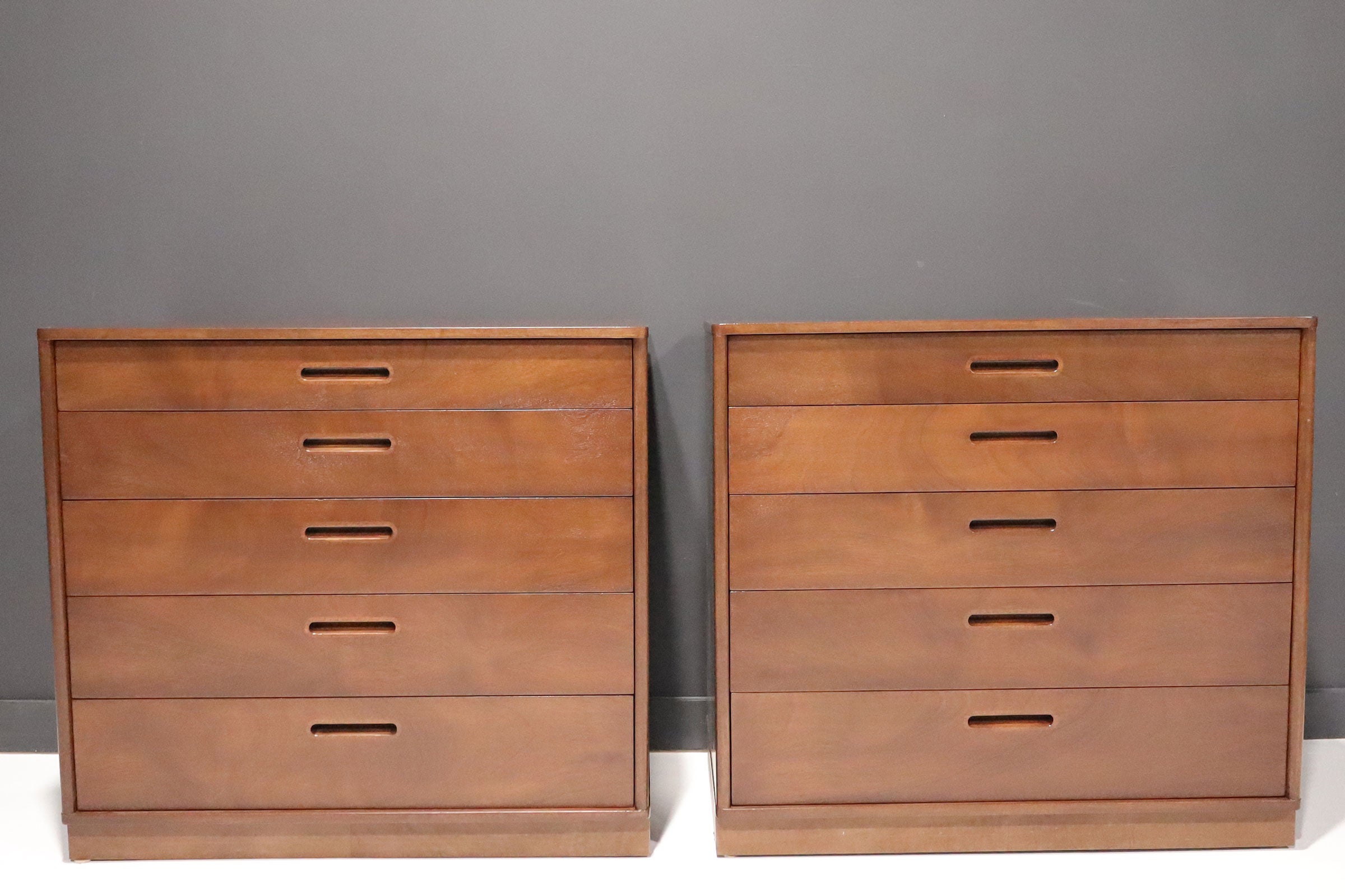 Beautifully crafted chest of drawers by Edward Wormley for Dunbar. These are mahogany and feature 5 drawers, 2 smaller than the other three. Make great nightstands or banking an entrance or fireplace.