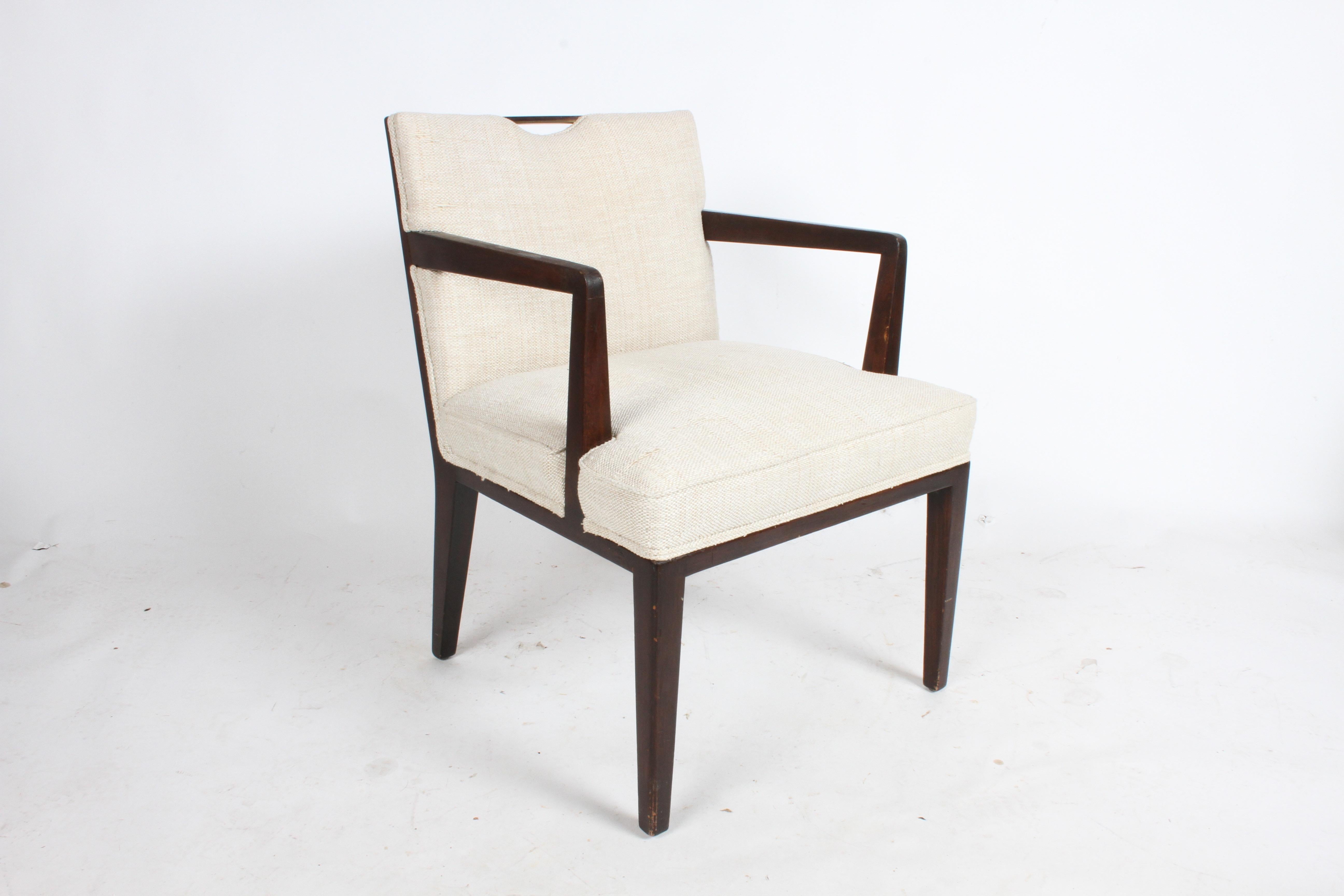 Listed are a pair of elegant Edward Wormley for Dunbar dining chairs with arms and brass handles. These are in need of restoration, perfect if your looking to add to your set. Also can be used as occasional chairs. Model 4710A, unmarked.