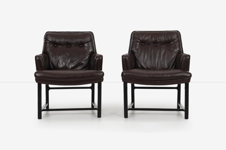 Pair of Edward Wormley for Dunbar pull-up lounge chairs. Model 971 Jansus line collection.
Wormley's Boutique line. Original chocolate brown leather with solid walnut legs.
[Dunbar tag on underside].

 