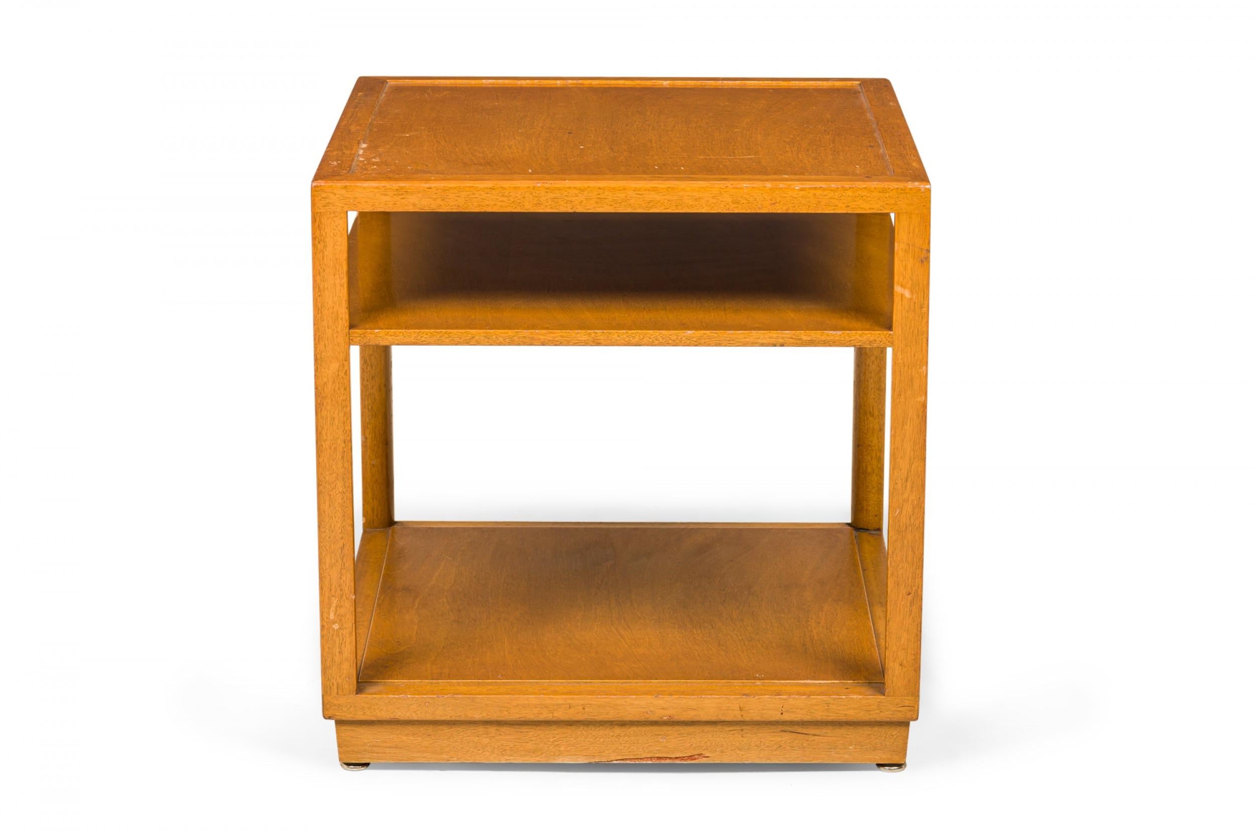 PAIR of American Mid-Century square lacquered wooden end / side tables with an open shelf below the square top, resting on a solid stepped base that creates as a taller lower shelf. (EDWARD WORMLEY FOR DUNBAR FURNITURE COMPANY)(PRICED AS