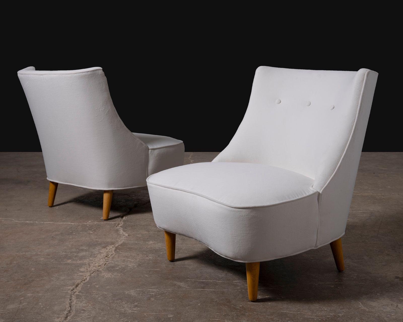 A stunning pair of Edward Wormley-designed Teardrop slipper chairs for Dunbar, showcasing the designer’s signature blend of sculptural elegance and modern restraint. These rare mid-century gems feature gracefully contoured backs and armless