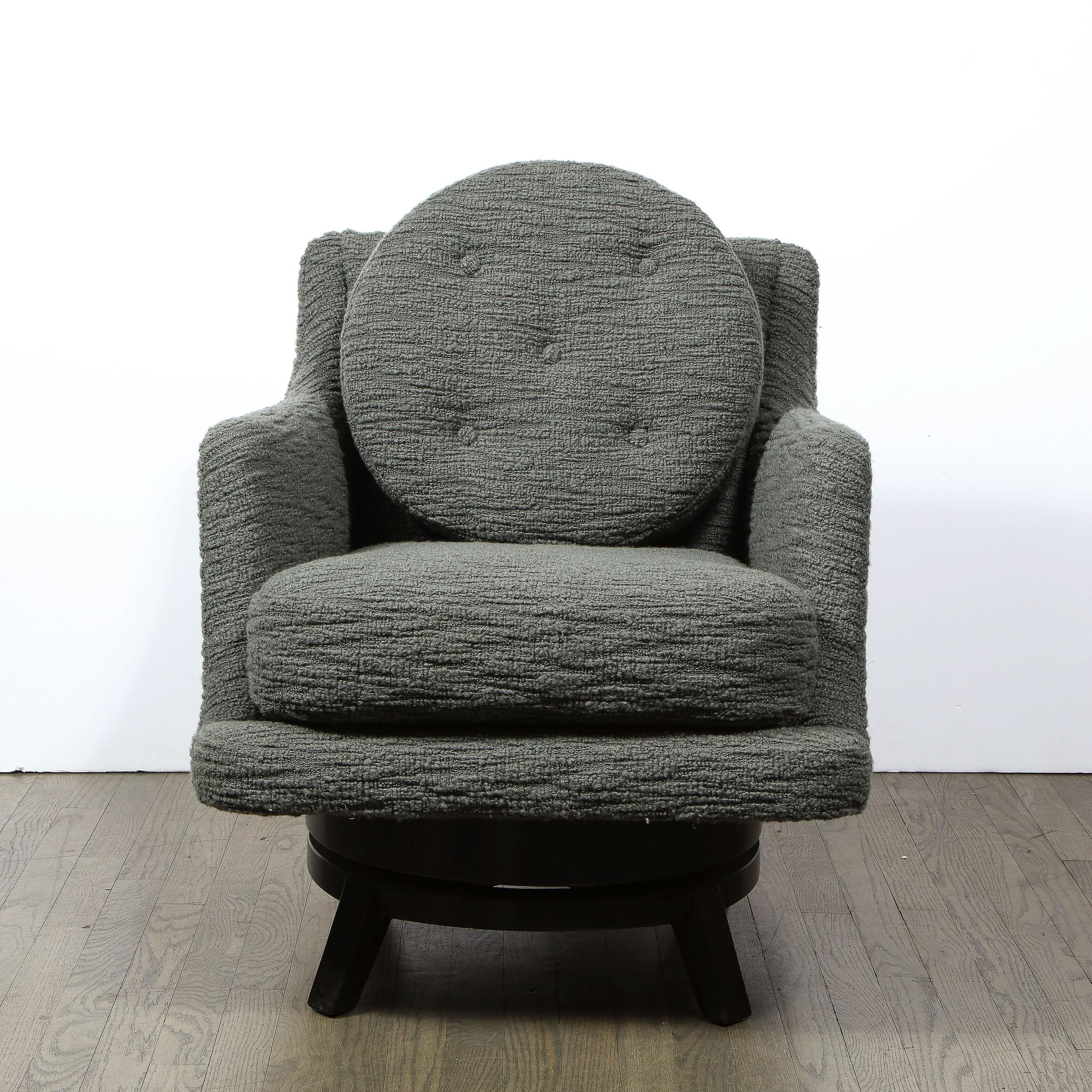 Designed by Edward Wormley for Dunbar, these swivel chairs are an excellent balance of simplified geometric forms delivering a powerful and charmed presence. Reupholstered in Holly Hunt Great Plains boucle in a Deep Loden hue, the calming color and