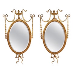 Pair of Edwardian Adam Revival Carved Giltwood and Gesso Wall Mirrors