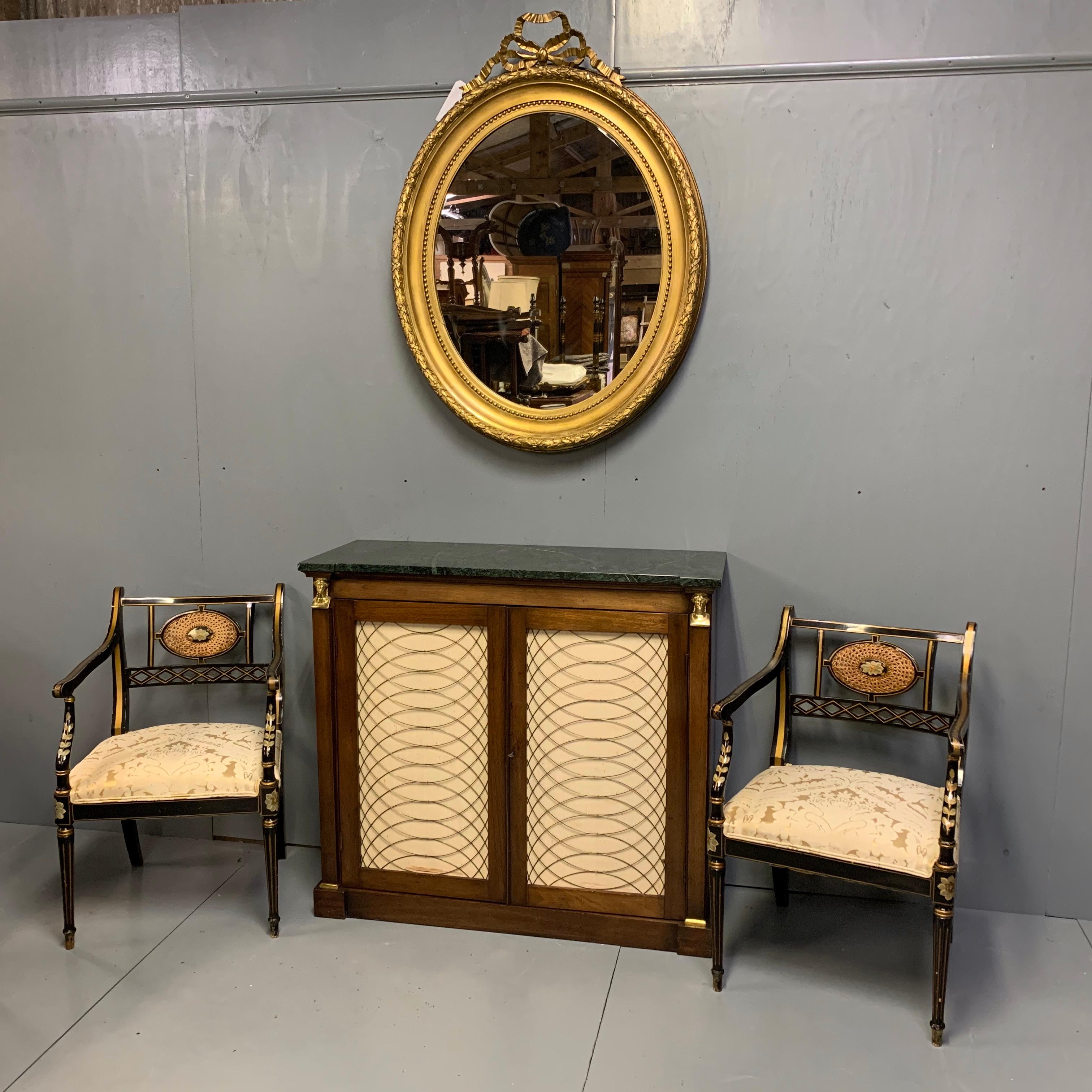 Beautiful pair of fine quality black lacquered and decorated elbow chairs with oval cane inserts and a gilt highlighting, circa 1900
Very nice proportions to these chairs and they are very decorative, although are practical too if you were to use