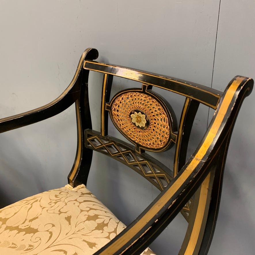 Blackened Pair of Edwardian Black Lacquered and Gilt Highlighted Elbow Chairs with Cane
