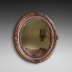 Pareja de espejos eduardianos con marco de madera dorada tallada y decoración floral