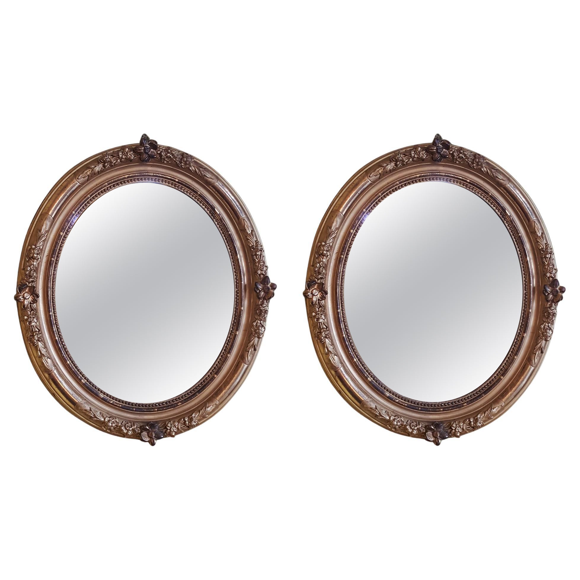 Pair of Edwardian Carved Giltwood Framed Mirrors with Floral Decoration