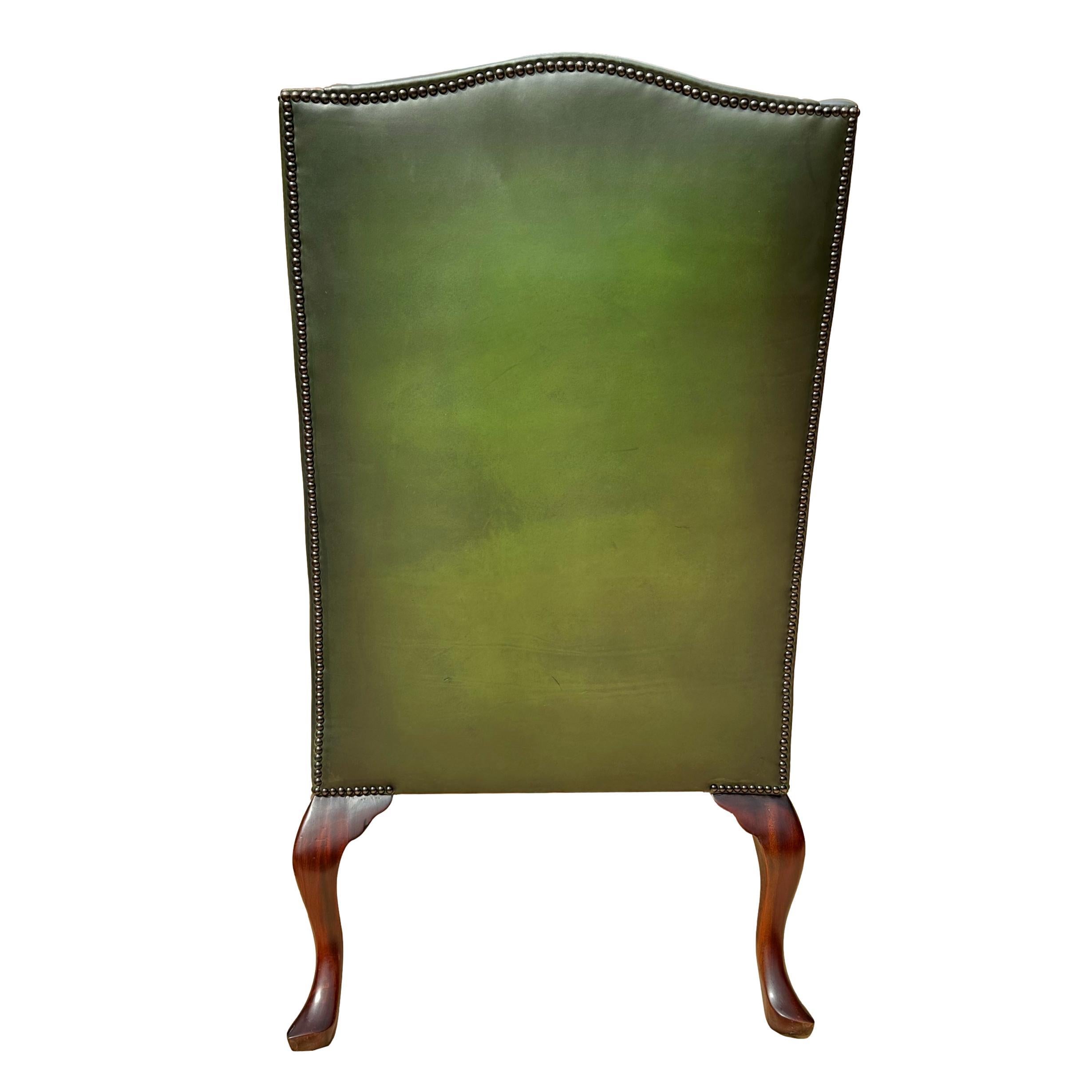 Early 20th Century Pair of Edwardian Green Leather Wing Back Chairs, English, ca. 1920. For Sale