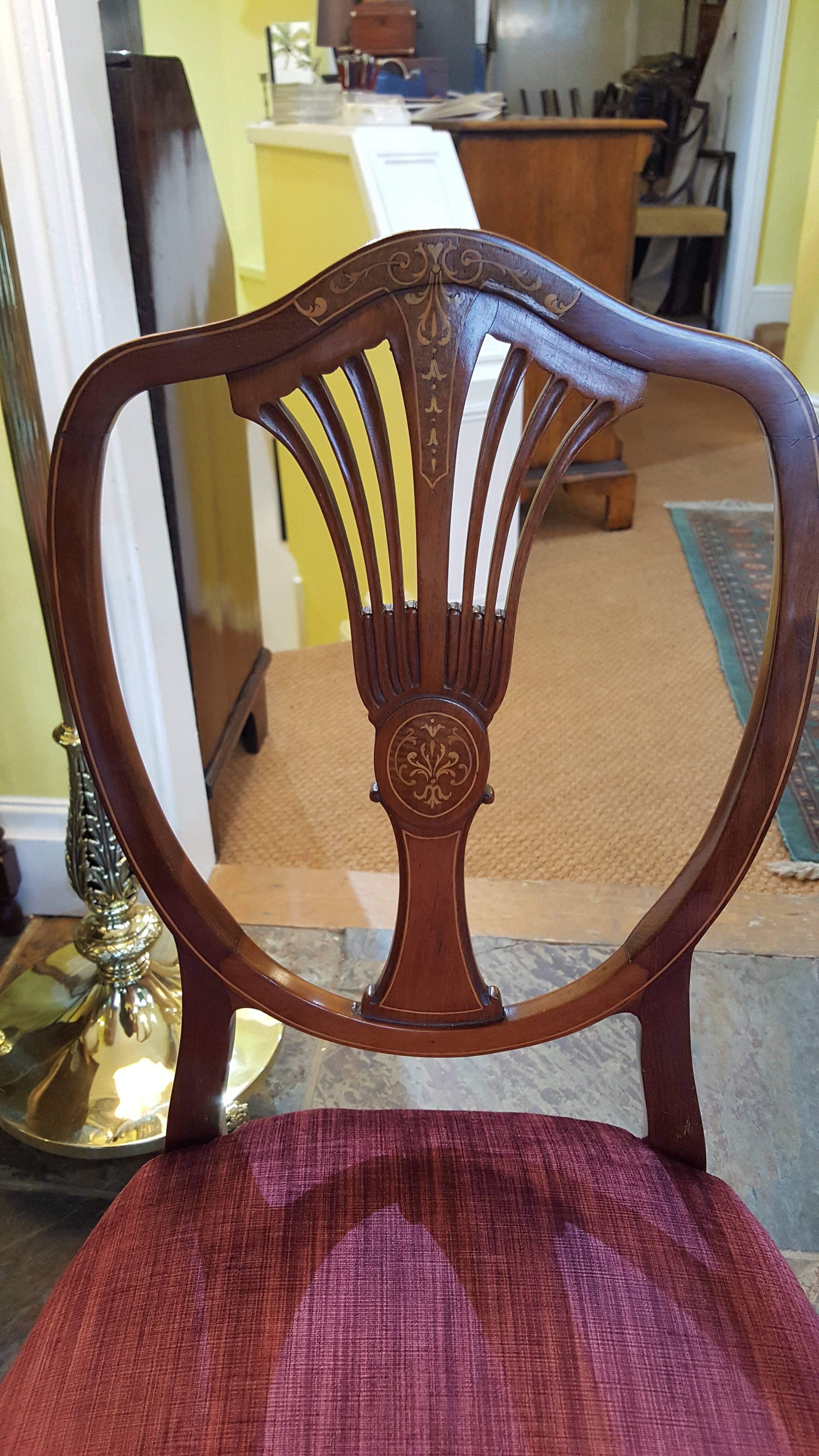 Pair of Edwardian mahogany and marquetry chairs with turned and line inlaid legs
Measures: 18