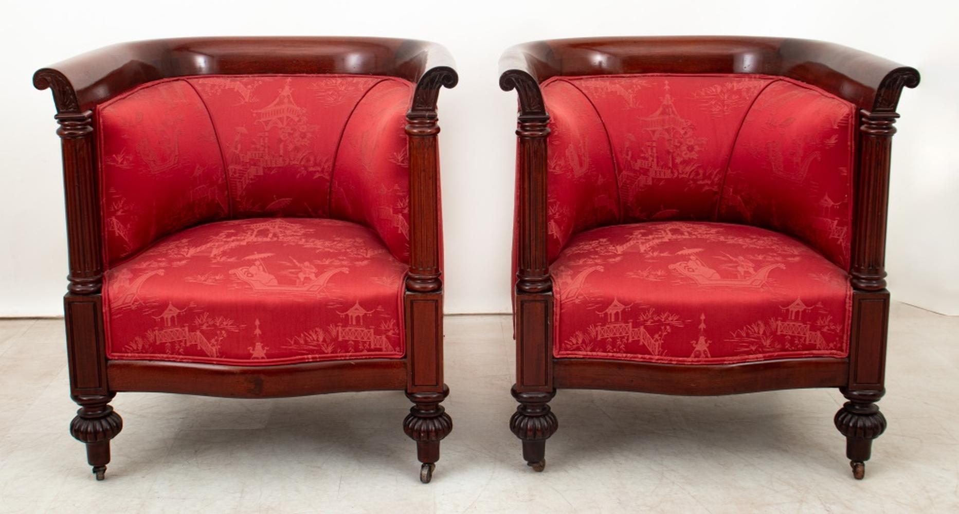 Pair of Edwardian Mahogany and Red Silk Tub Chairs, each with fluted columnar supports on bun feet and brass casters. 33