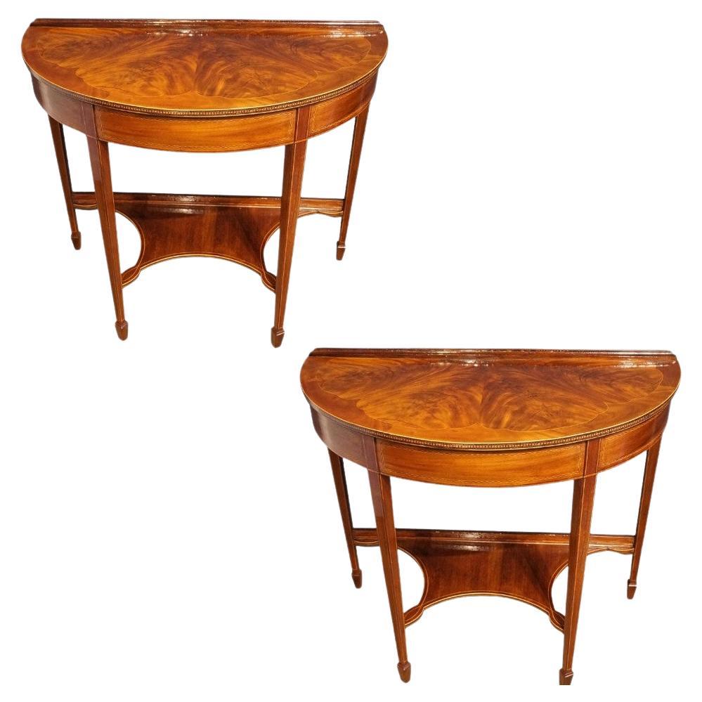 Pair of Edwardian mahogany demi lune console tables