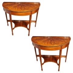 Pair of Edwardian mahogany demi lune console tables