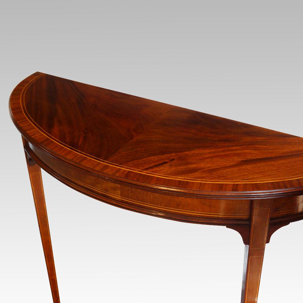 Pair of Edwardian mahogany demilune tables
This pair of Edwardian mahogany demilune tables are fantastic for you home.
Due to the lovely narrow size these will fit in narrow passages, hallways or in alcoves.
This was originally a single table but