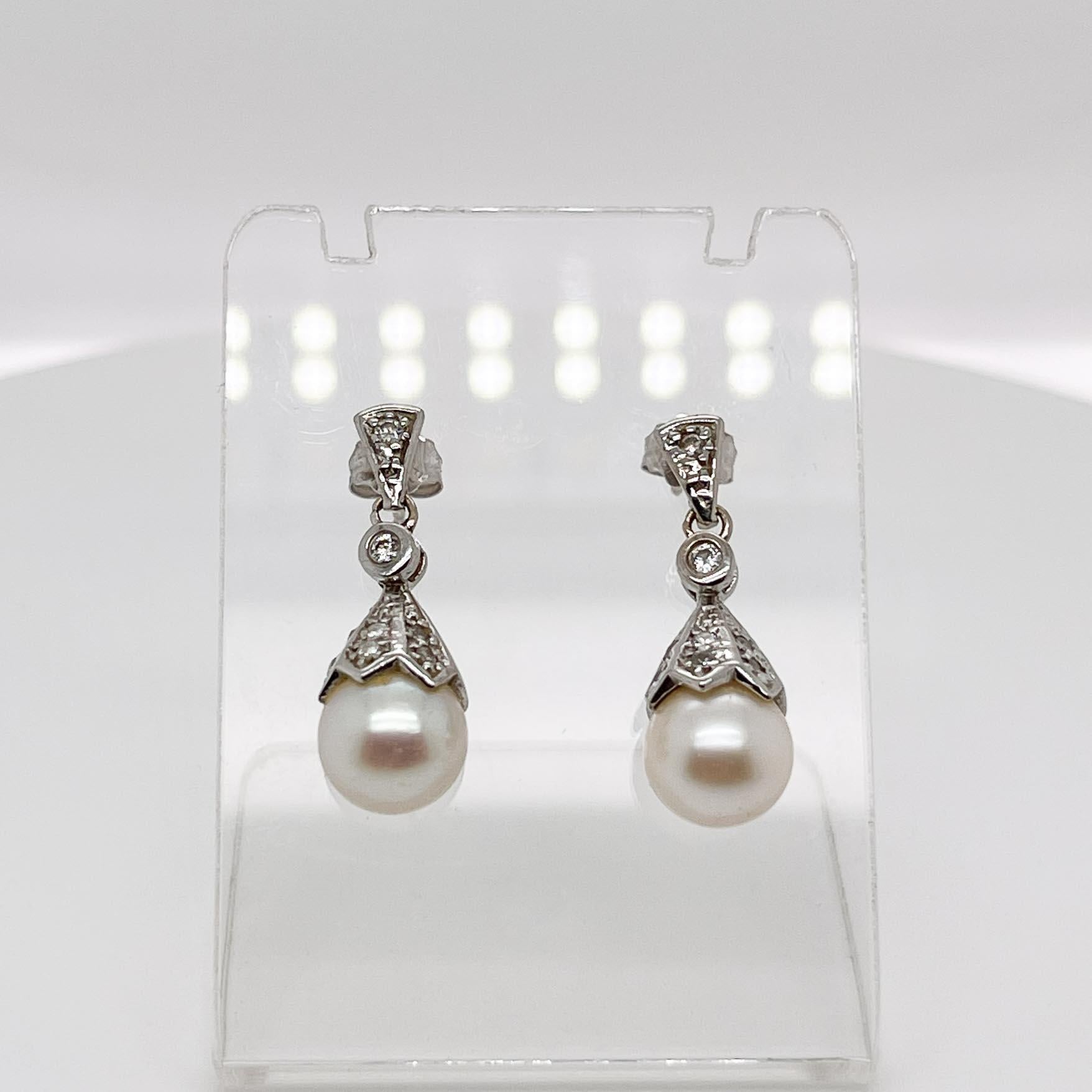 Pair of Edwardian Style Pearl, Diamond & 14 Karat White Gold Earrings In Good Condition In Philadelphia, PA