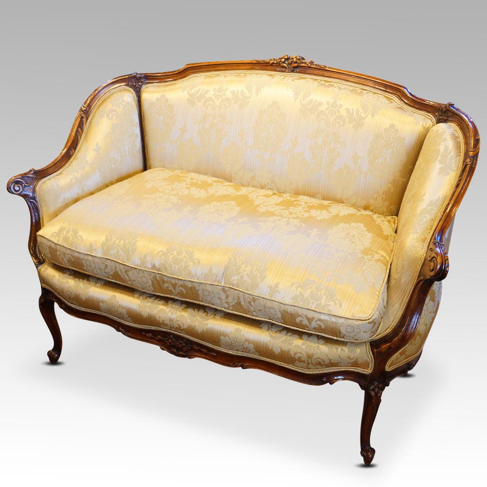 Pair of Edwardian walnut small sofas   
This Pair of Edwardian walnut small sofas were made circa 1910.
These delightful sofas have a solid walnut frame, styled in the French manner.
The Edwardian era was known as the age of elegance, and these are