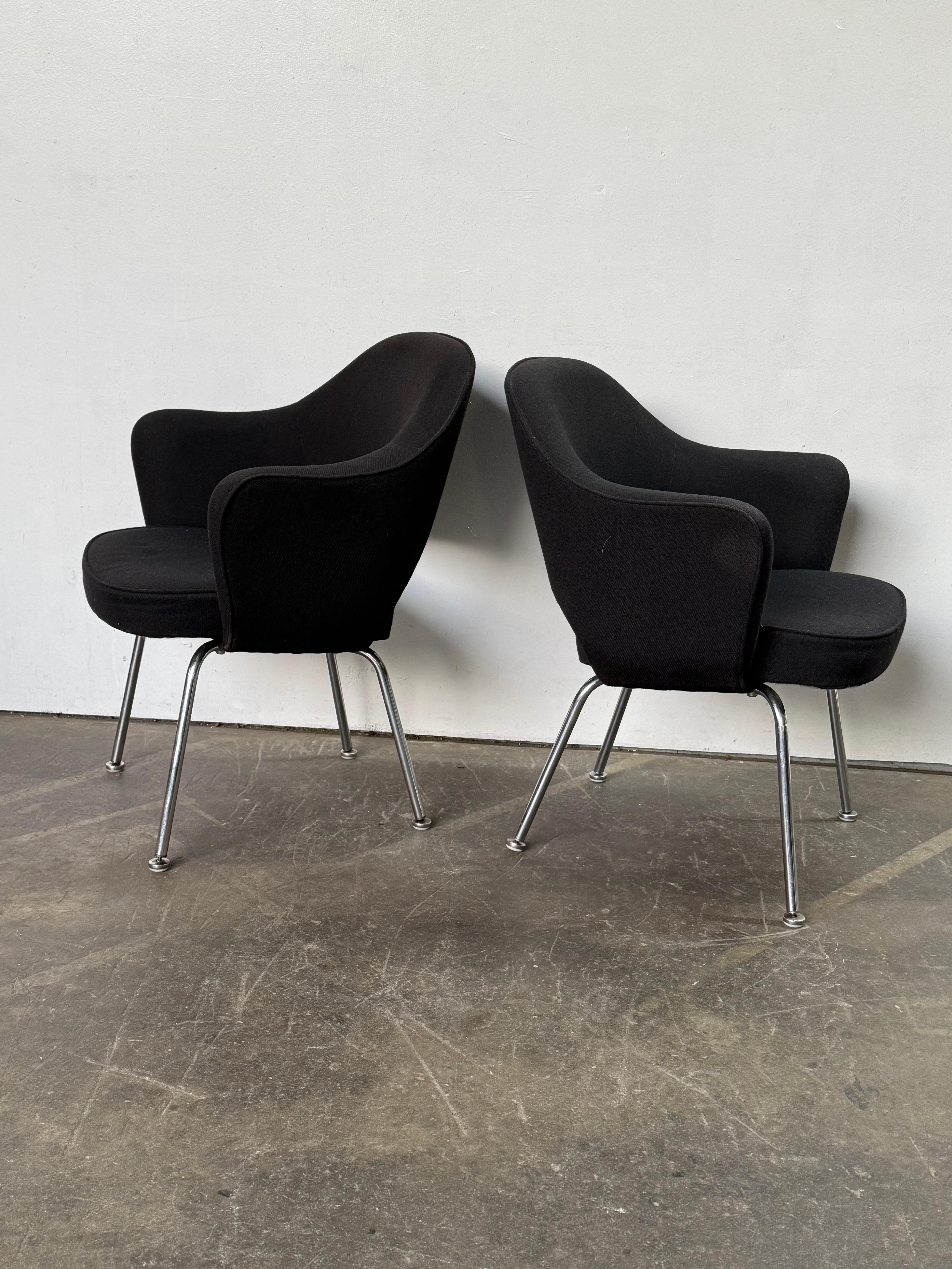 Pair of Eero Saarinen Executive Armchairs for Knoll. Vintage production, reupholstered in 1998. All screws and self leveling glides intact. No rips in the textile. Cleaned and present well. Chrome finish in good shape. 