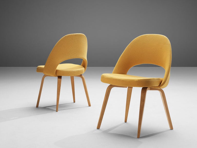 Eero Saarinen for Knoll International, pair of model 72 chairs, in wood and yellow fabric, United States 1948. 

Pair of organic shaped chairs designed by Eero Saarinen. A fluid, sculptural form. This timeless and versatile design continues to fit