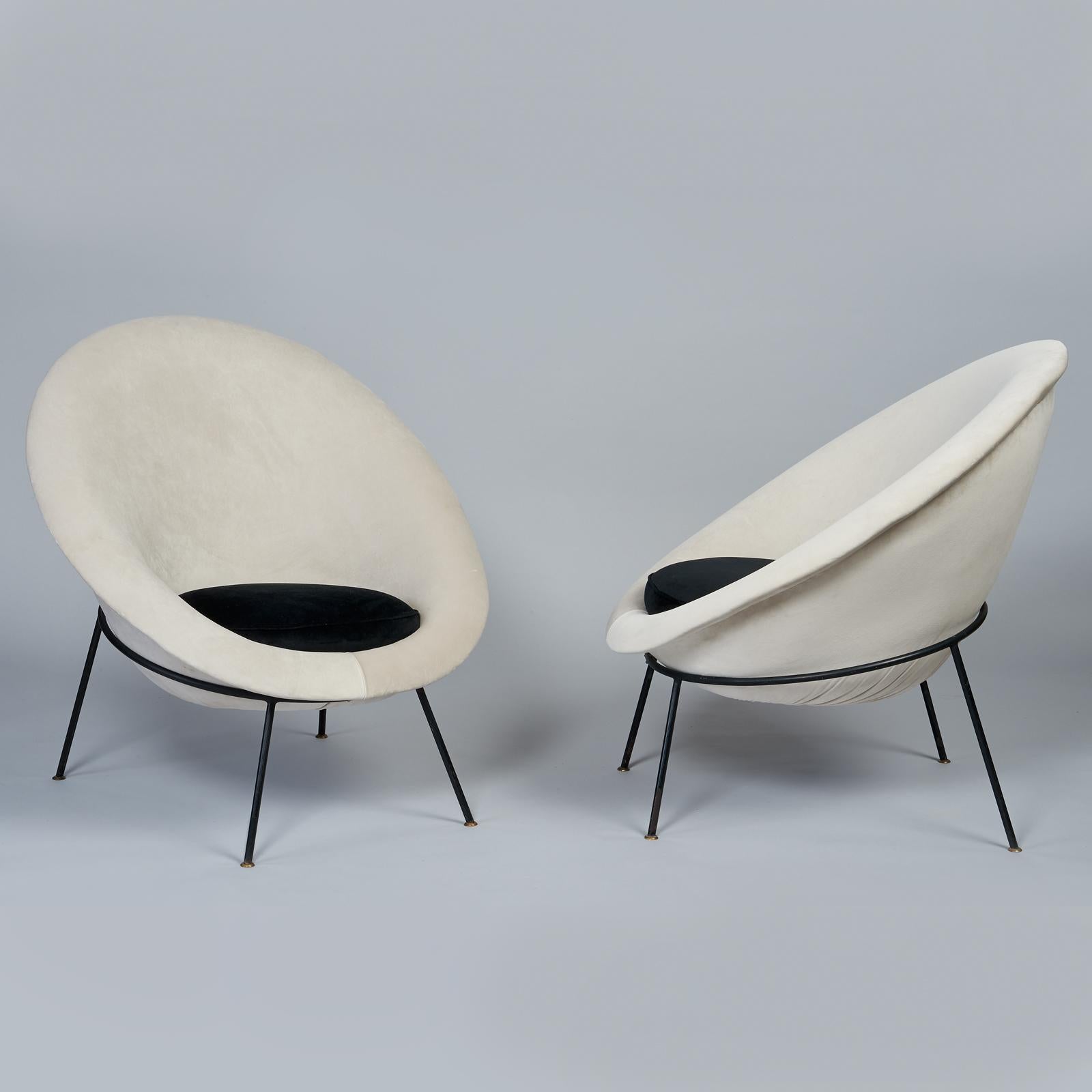 Ico Parisi, att. (1916 - 1996)

A beautiful early pair of modernist Egg lounge chairs attributed to Ico Parisi and manufactured by Ariberto Colombo, upholstered in soft dove grey velvet with black velvet cushions, raised on elegant black lacquered