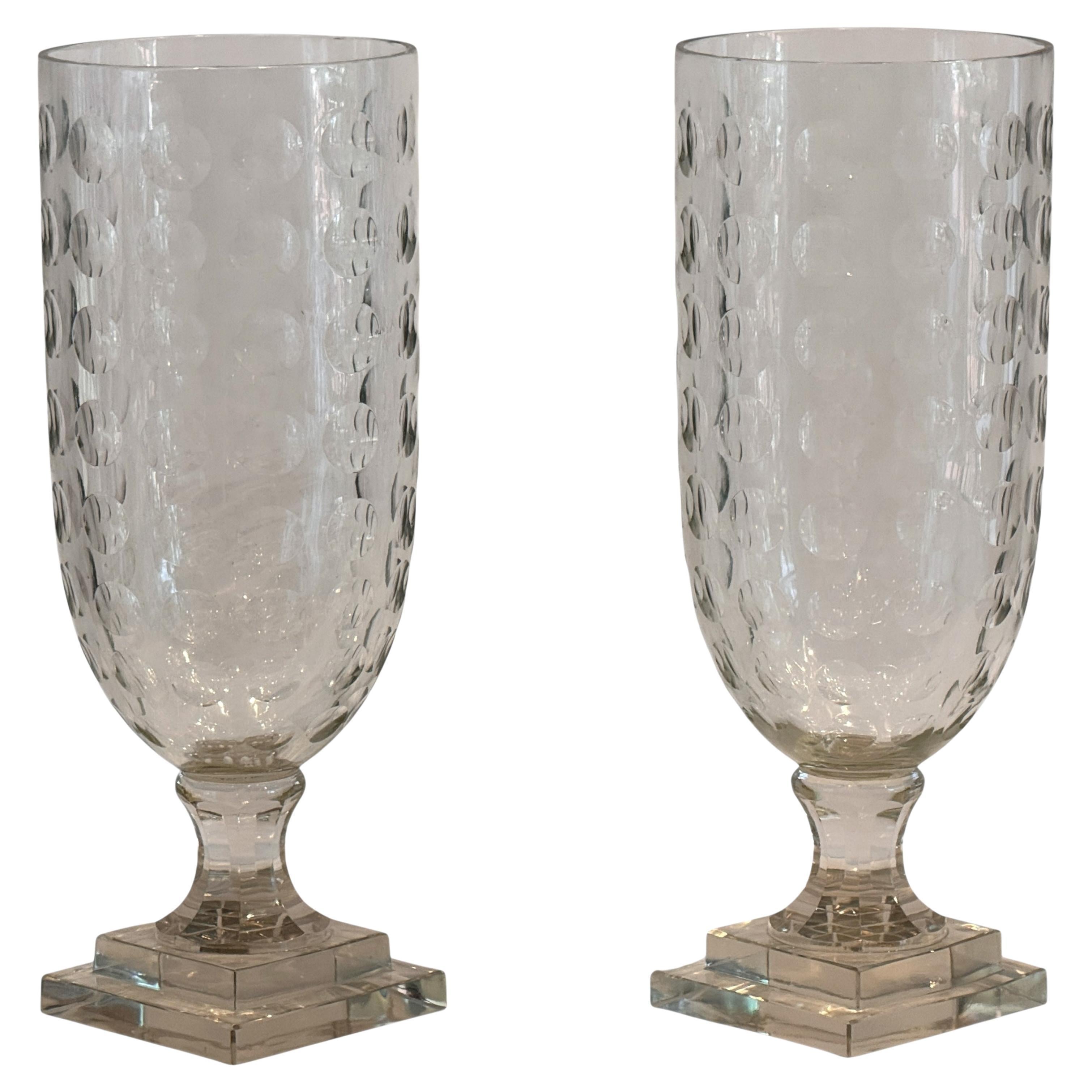 Pair of Egg-Cut Glass Urns on Tiered Bases