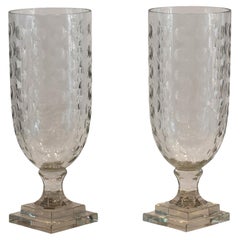 Pair of Egg-Cut Glass Urns on Tiered Bases