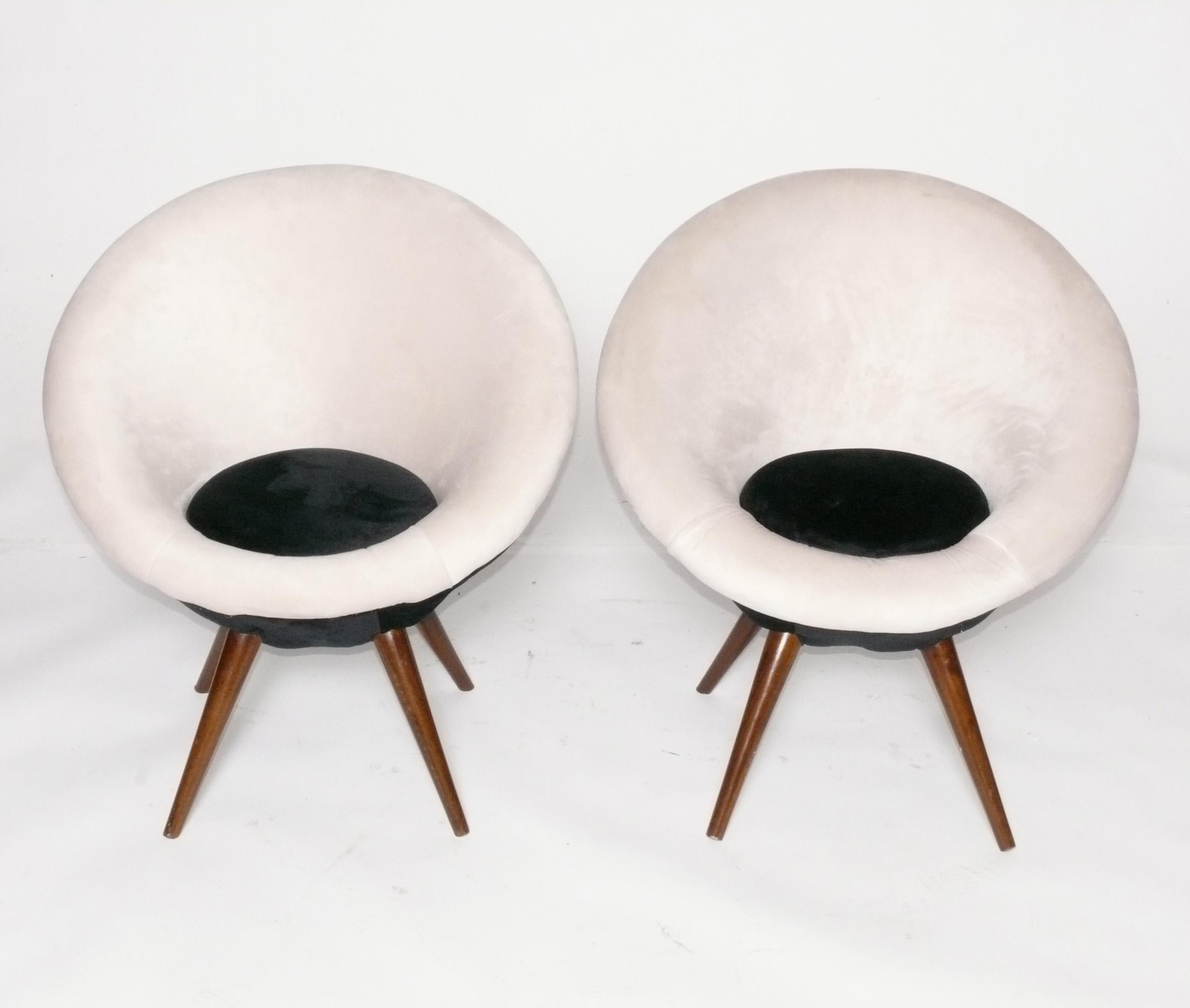 Pair of Sculptural Ouef or Egg Lounge Chairs, circa 2000s. This is based on a 1950s French design and these examples were produced in the 2000s. They are a petite size and would be great in a childs room.