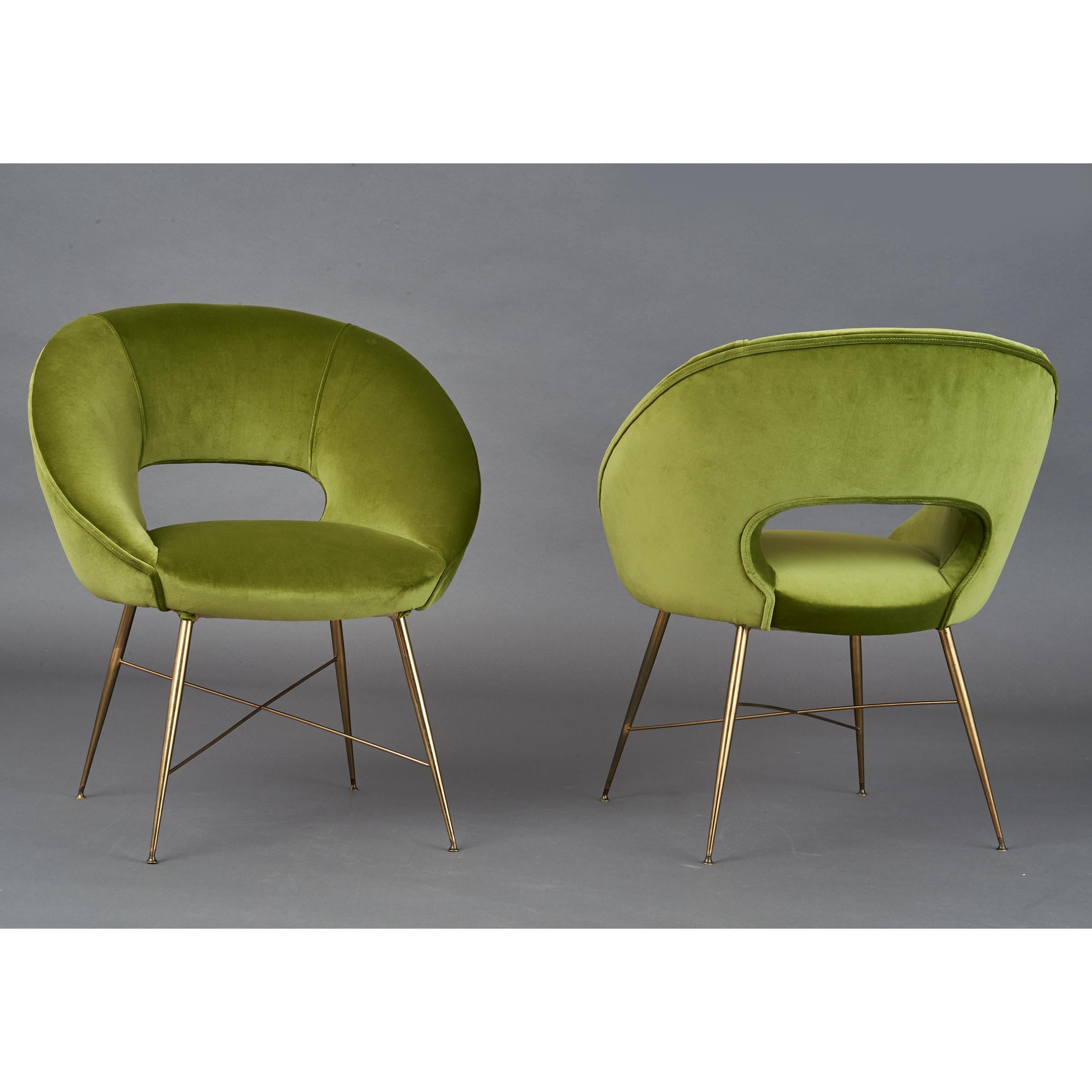 Italy, 1950s
A light and lively pair of egg shaped Modernist armchairs with cut out in back, tapering brass legs and cross stretchers.
26 W x 24 D x 29 / 16 H
Newly upholstered.