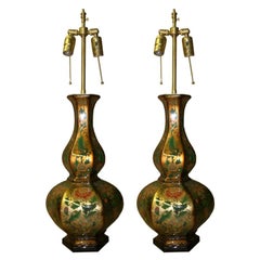 Pair of Eglomise vases with lamp application.