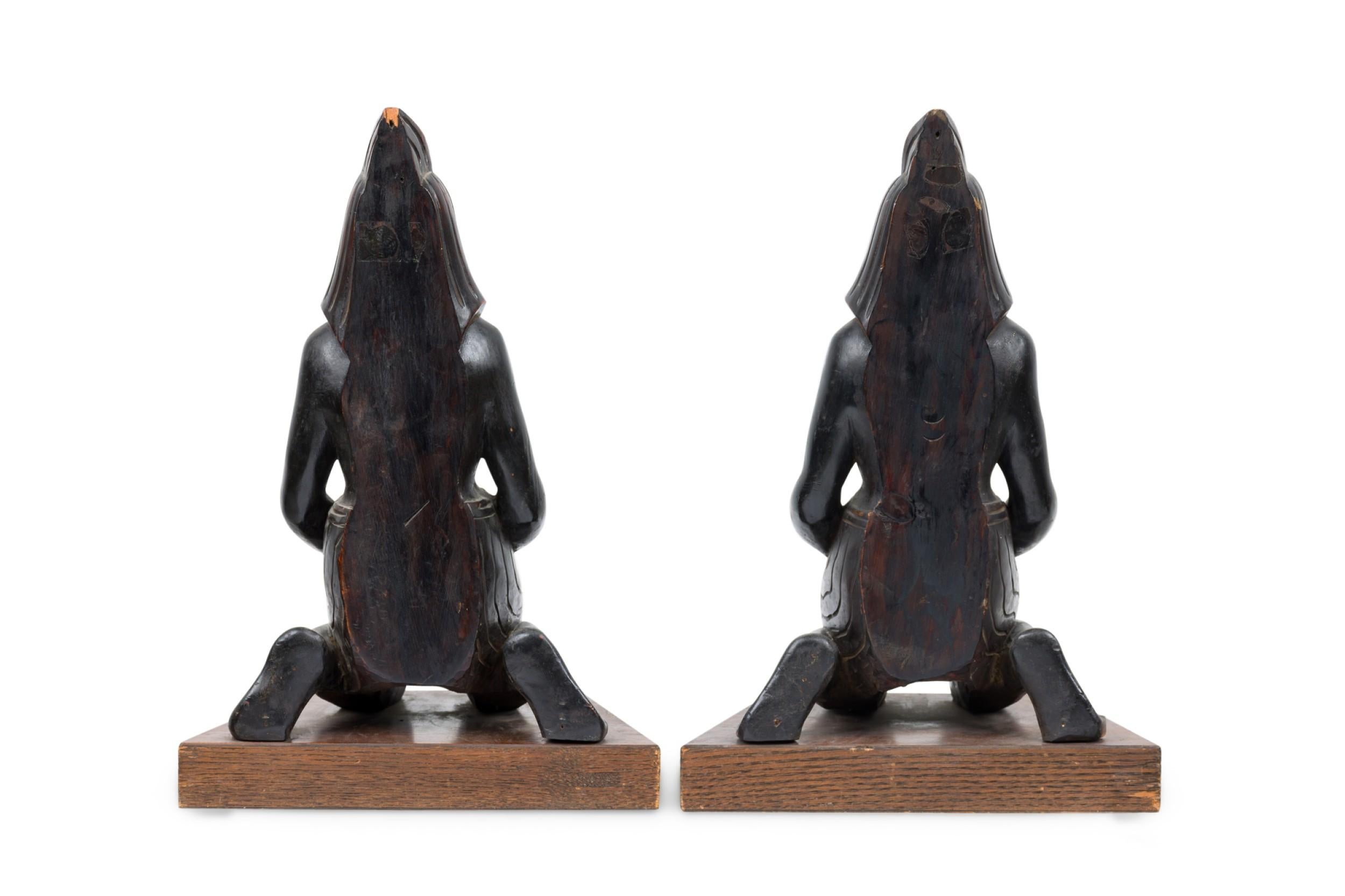 Unknown Pair of Egyptian Carved Ebonized Kneeling Figures For Sale