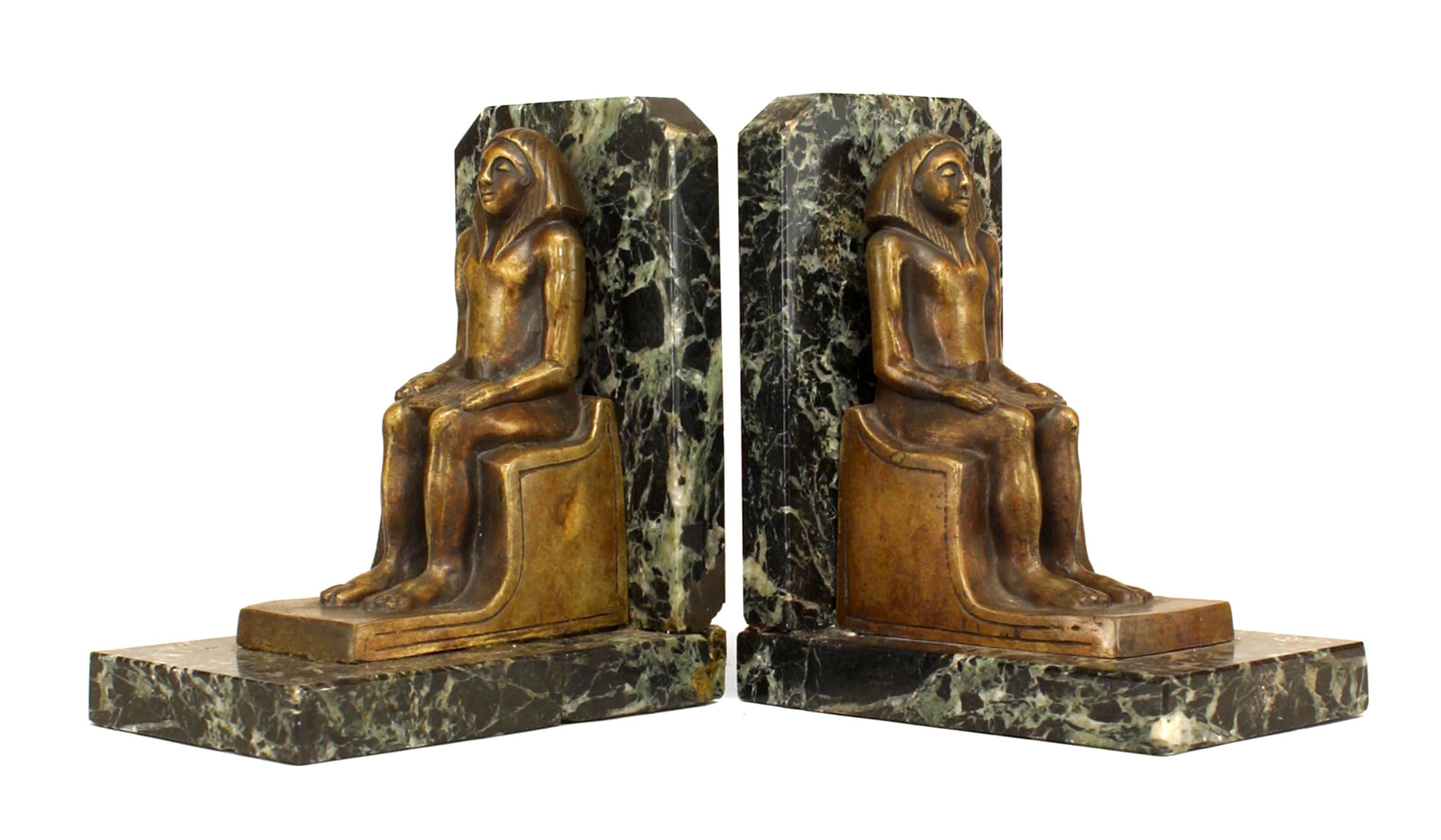 Pair of Egyptian-style (20th Century) green marble bookends with bronze figure (PRICED AS Pair)

Imperfections on marble of one bookend