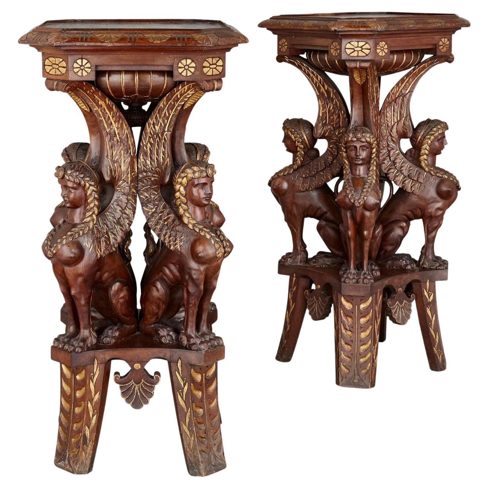 Pair of Egyptian Revival carved and gilt wooden pedestals For Sale