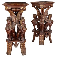Pair of Egyptian Revival carved and gilt wooden pedestals