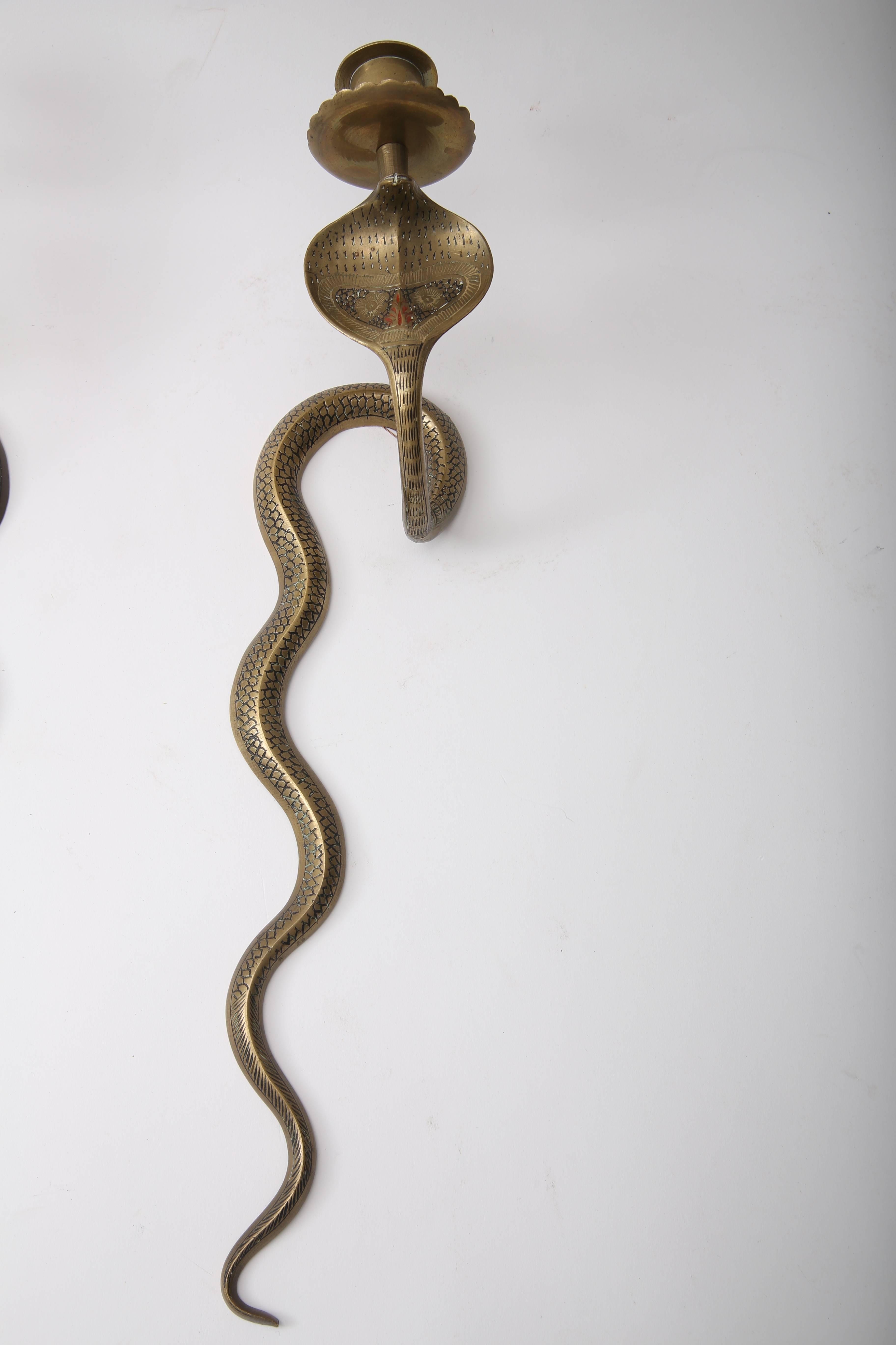 This stylish set of Egyptian Revival wall-mount, cobra-form candleholders will make the perfect addition to your French Empire setting or perhaps as an exotic accent to a modern interior.
The set dates to the late 19th century and have aged to a