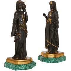 Pair of Egyptian Revival Patinated Bronze Figures