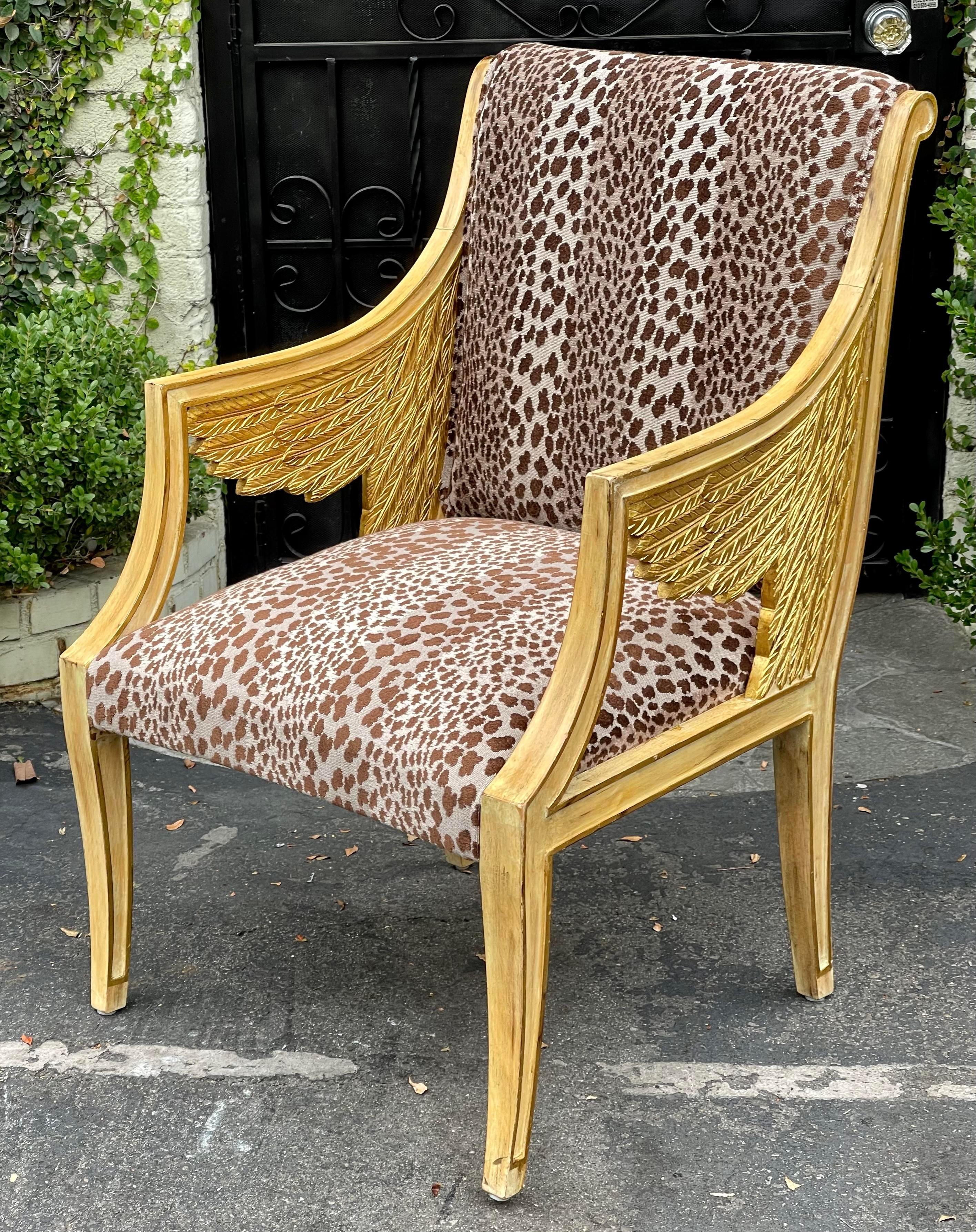 Pair of Egyptian style winged neoclassical giltwood arm chair w cheetah velvet.