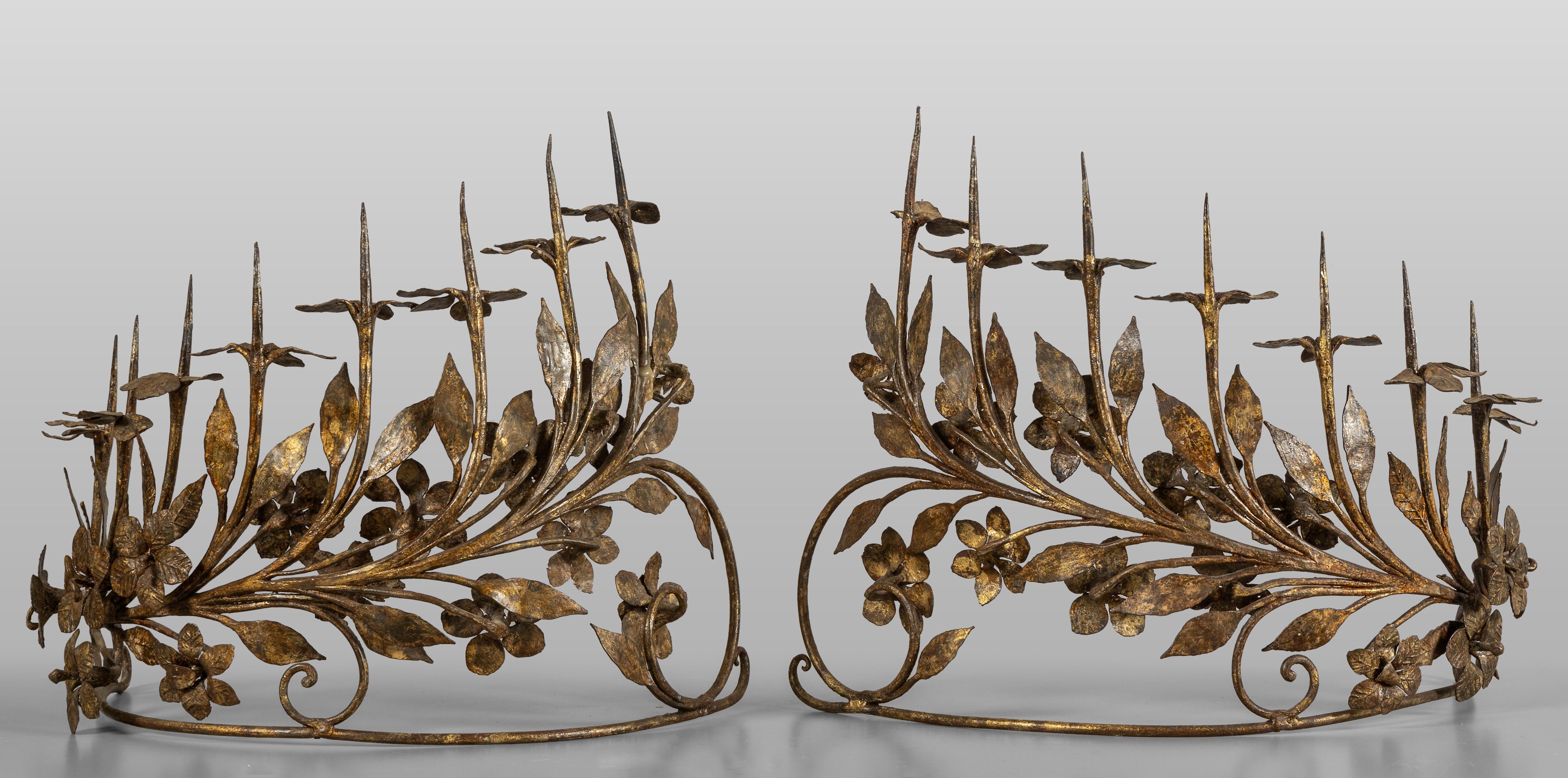 Pair of eight-light antique vintage Italian candelabrum in wrought gilded iron

Anonymous
Probably early 20th century; Italy
Iron

A distinctive pair of curved and crown-like beautiful eight-light vintage Italian gilt-iron candelabrum with integral