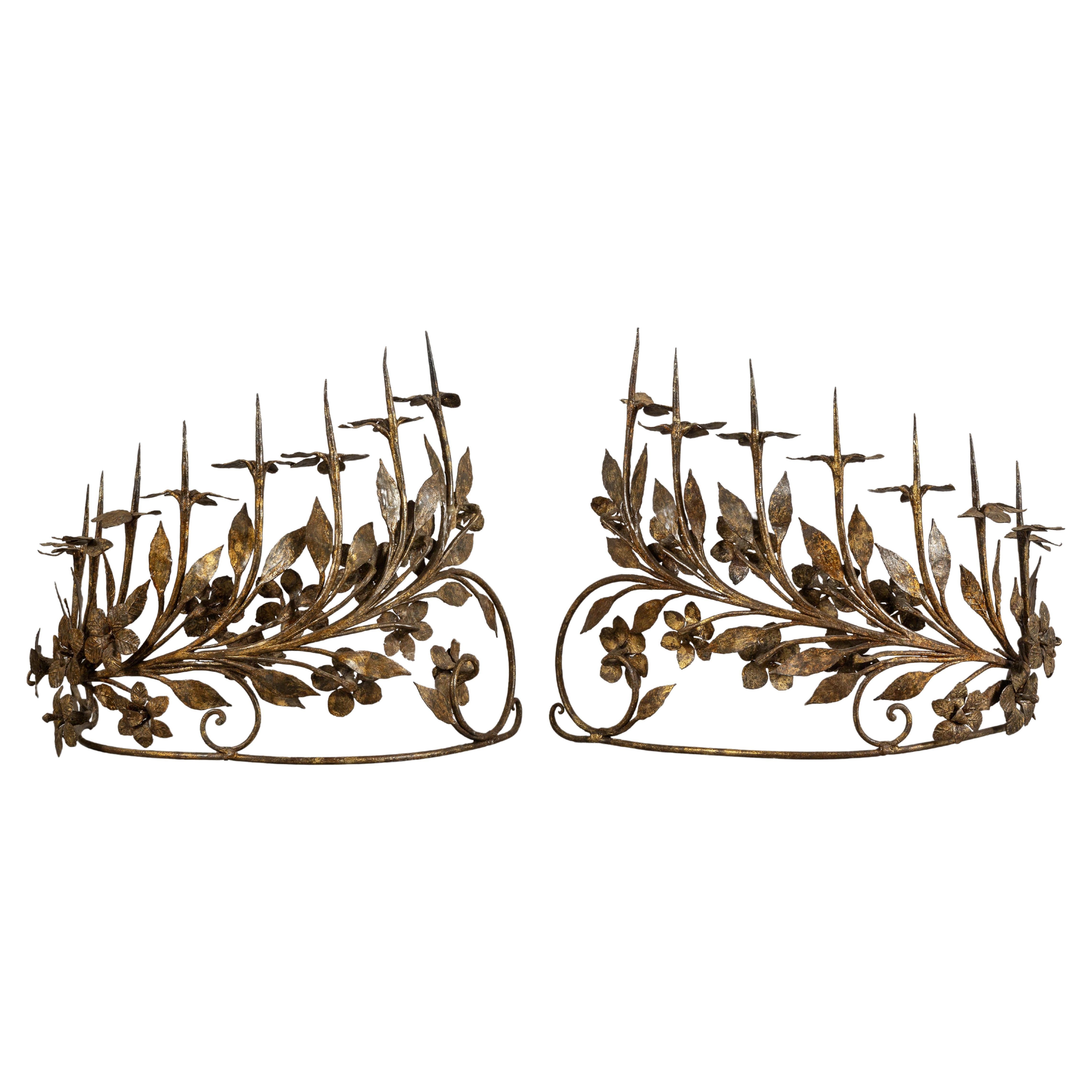 Pair of eight-light antique vintage Italian candelabrum in wrought gilded iron For Sale