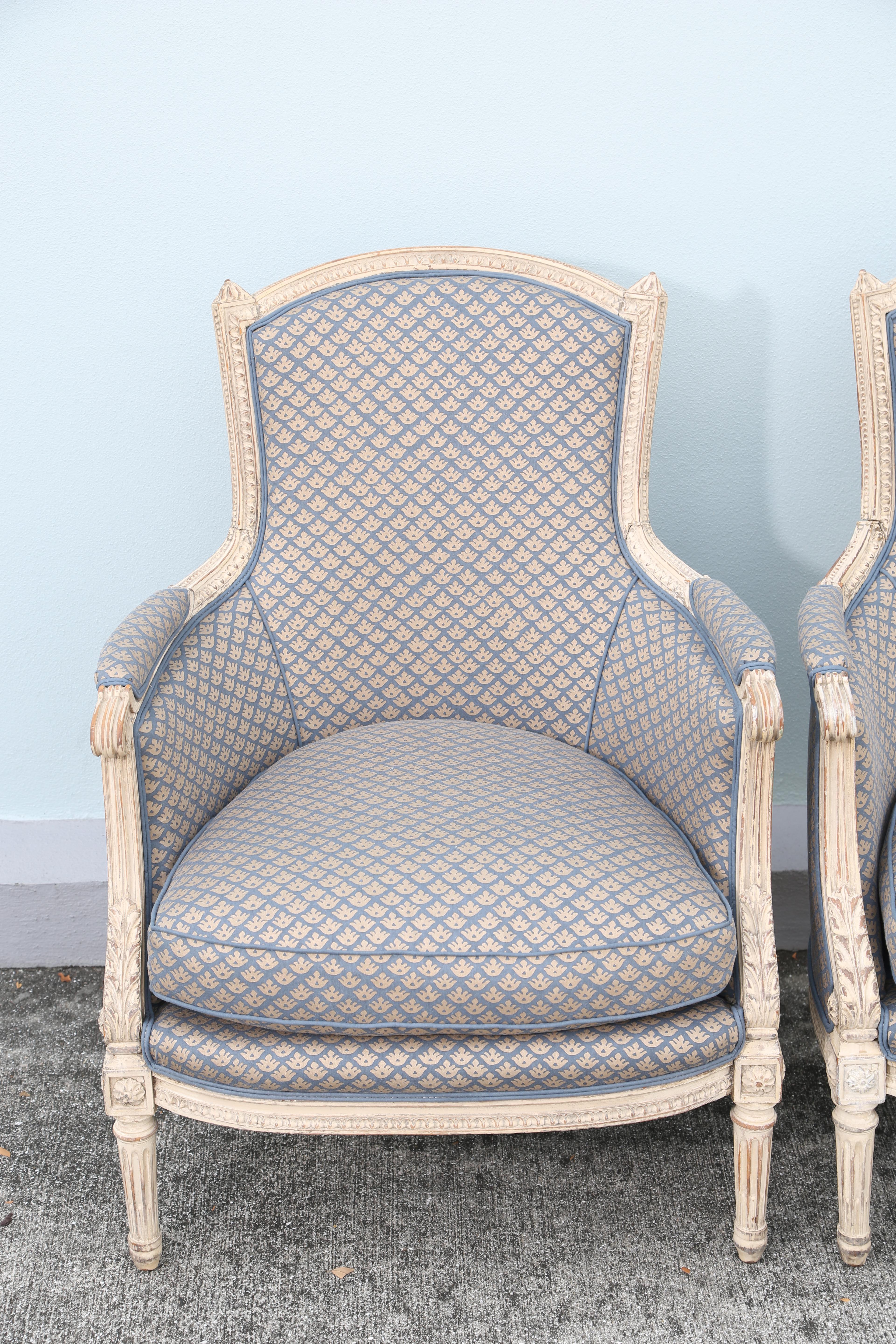 Stunning pair of painted bergère with original paint and newly upholstered in Fortuny fabric.