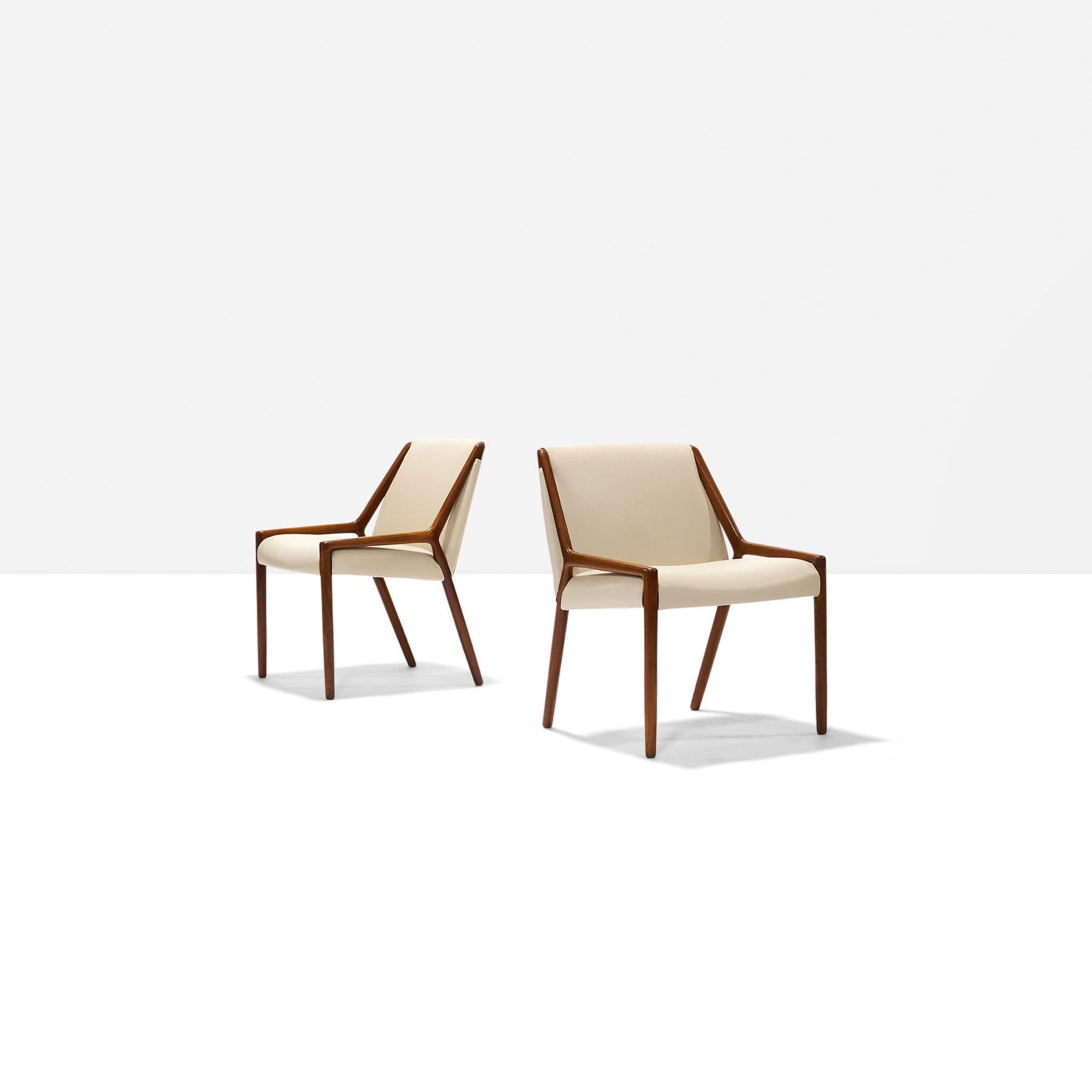Pair of teak and leather occasional chairs by Ejner Larsen and Aksel Bender Madsen for Willy Beck.
Replaced cream colored leather. Chairs being sold as a set or separately. In excellent condition.