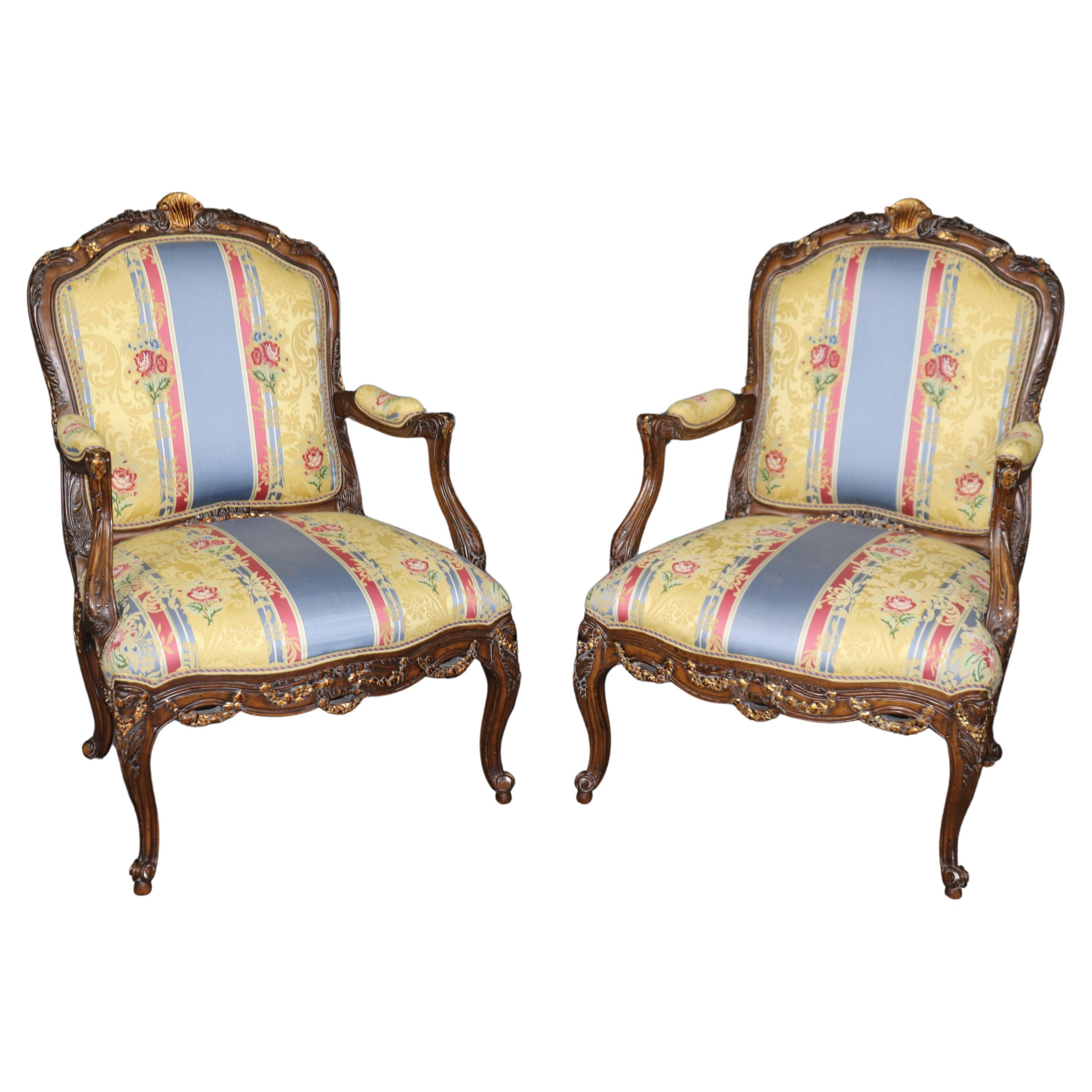 Pair of Elaborately Carved Gilt Decorated Walnut Louis XVI Decorative Armchairs