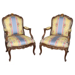Pair of Elaborately Carved Gilt Decorated Walnut Louis XVI Decorative Armchairs