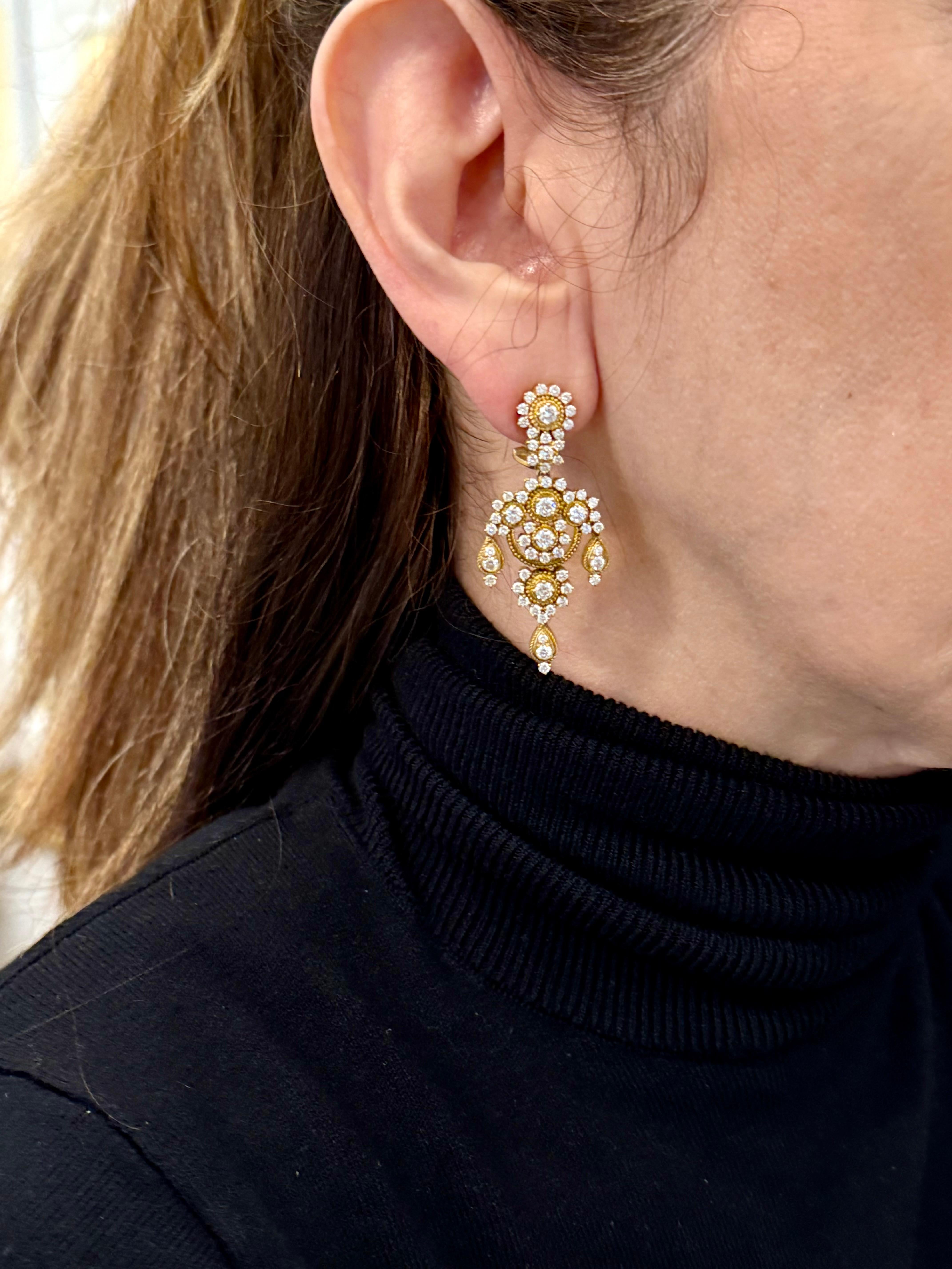 These Chandelier-style drop design earrings are full of sparkle! Made in 18 K yellow gold with twisted and beaded gold wire. comfortable to wear with Omega backs.
Set with 132 round brilliant cut Diamonds weighing approximately 4.25 ct, H color,