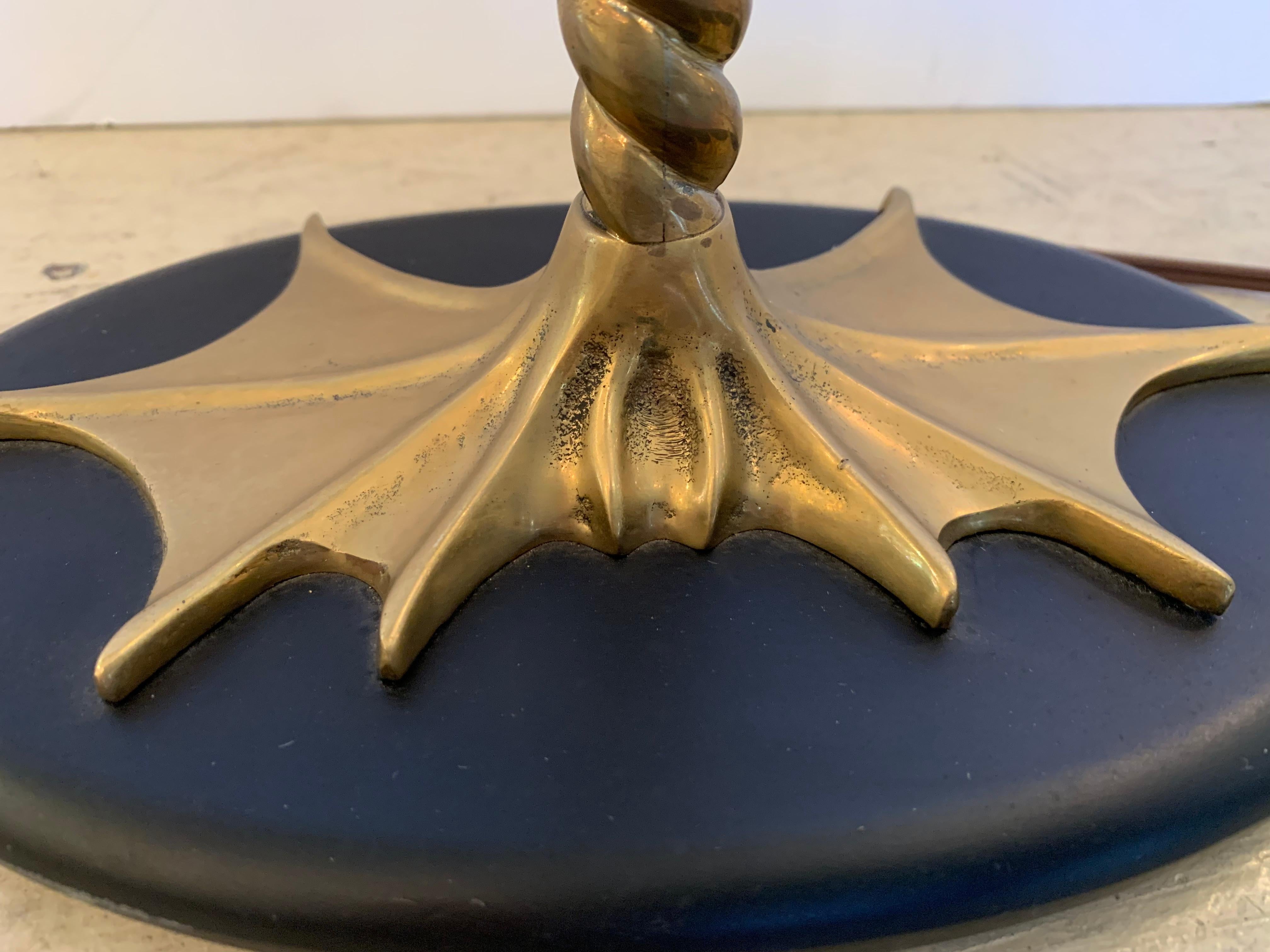A Chapman pair of elegant tall table lamps having stylized brass frogs on twisted brass stands that terminate in frog feet on black bases. The green shades are custom and there are acorn finials.
Measures: Base 9” W x 5.5” D
33” H
Shade 14” W x