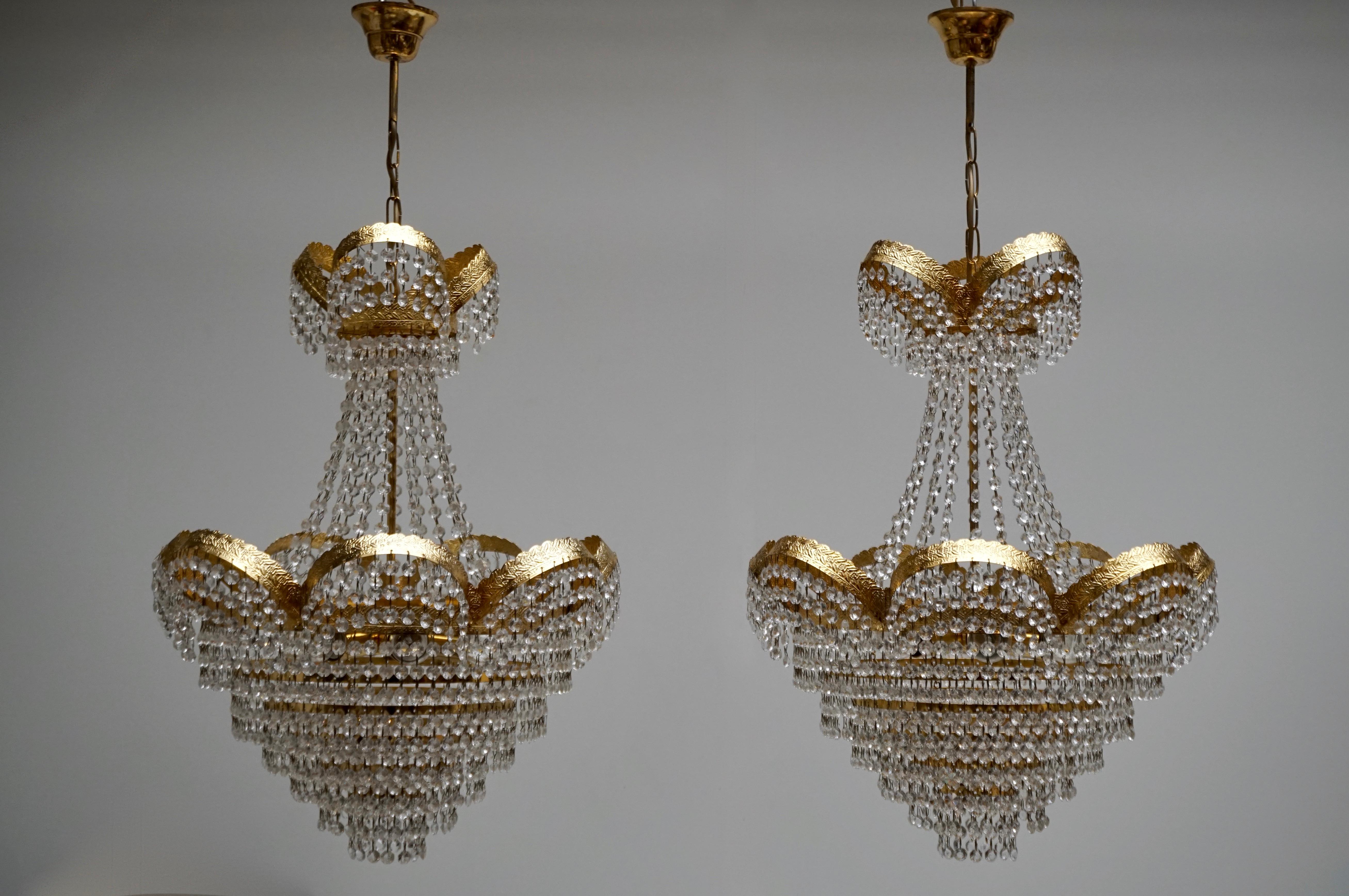 One Elegant crystal and brass chandelier from the 1950s-1970s.
Please note that price is per item not for the set.
Measures: Diameter 50 cm.
Height fixture 65 cm.
Total height including the chain 90 cm.
The light requires six single E27 screw fit