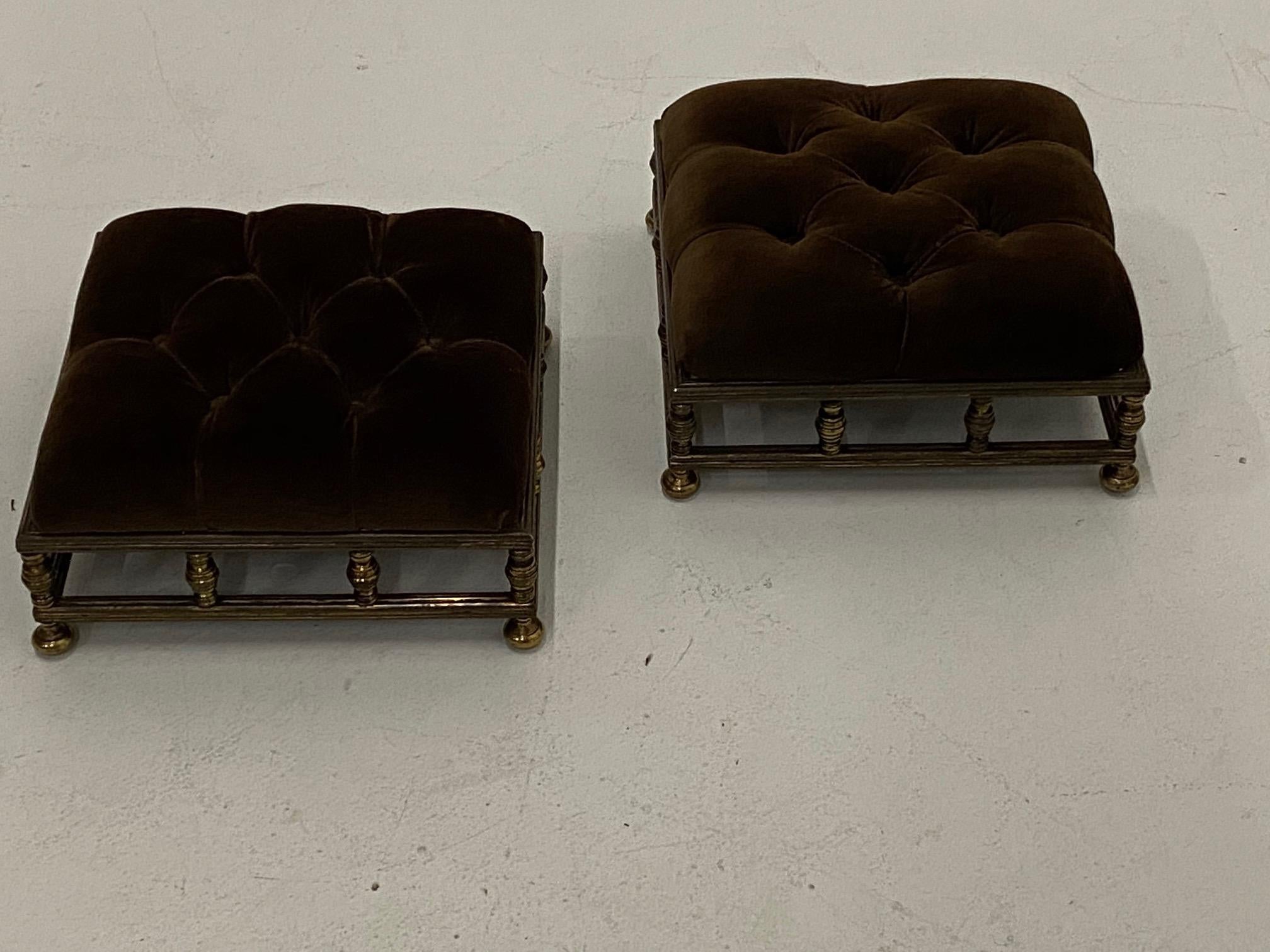 Sumptuous pair of Edwardian style footstools having brass bases and tufted brown velvet tops.